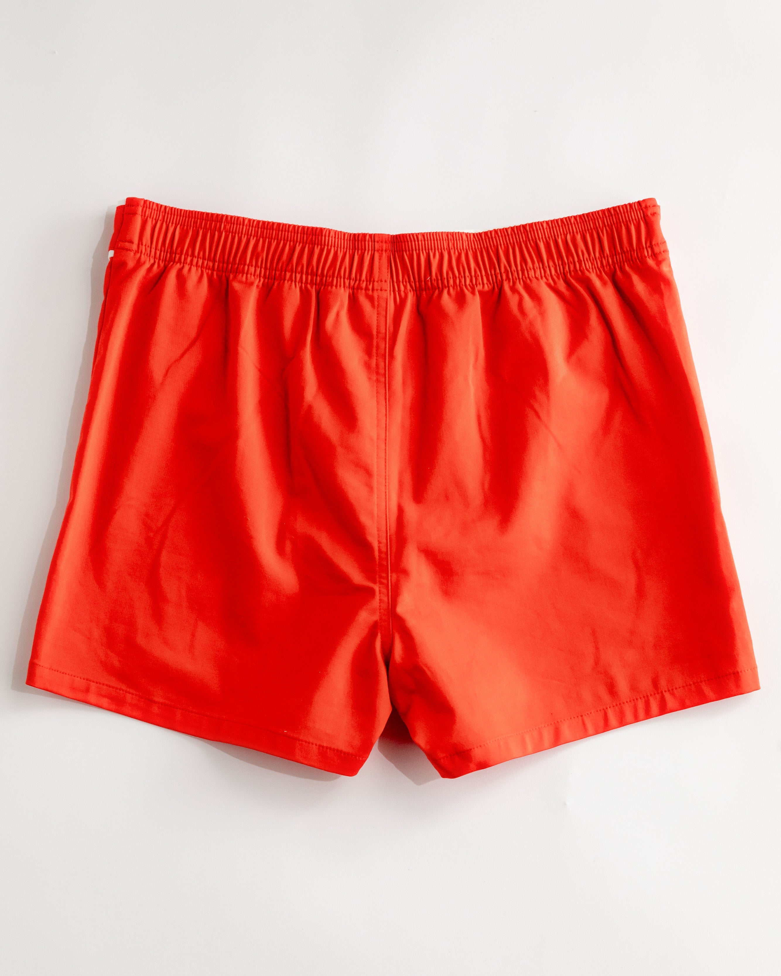 man wearing red trunks