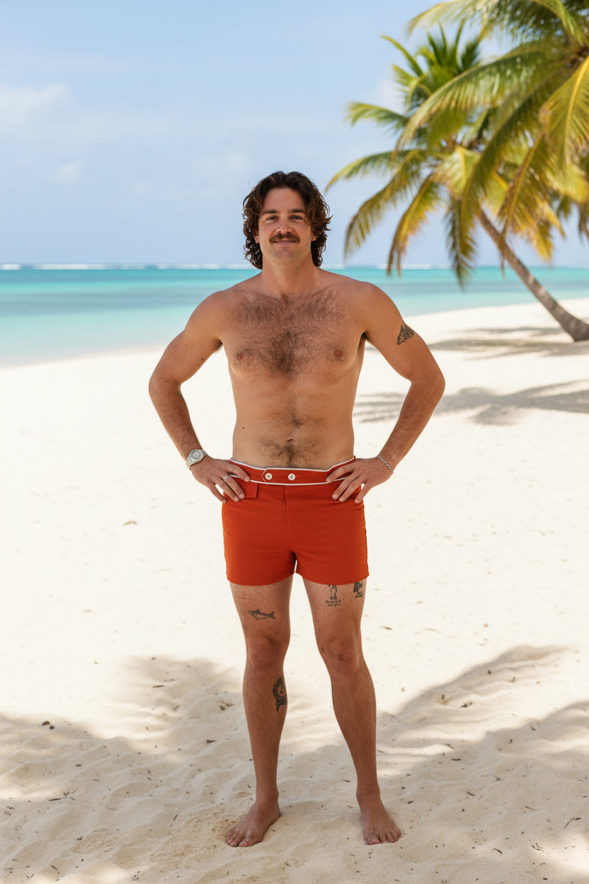 Man wearing red boxer briefs on a white background