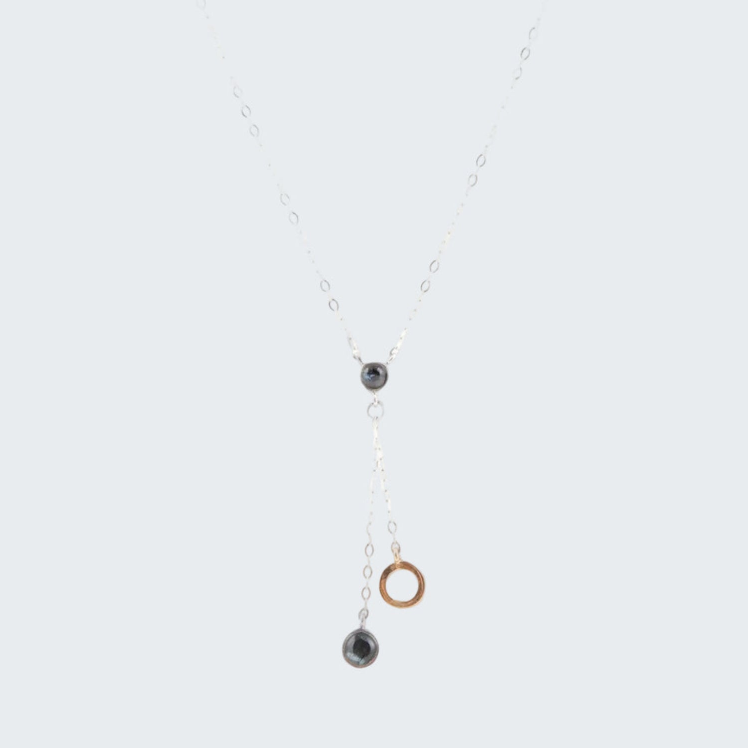 Necklace with circular pendants on a white background