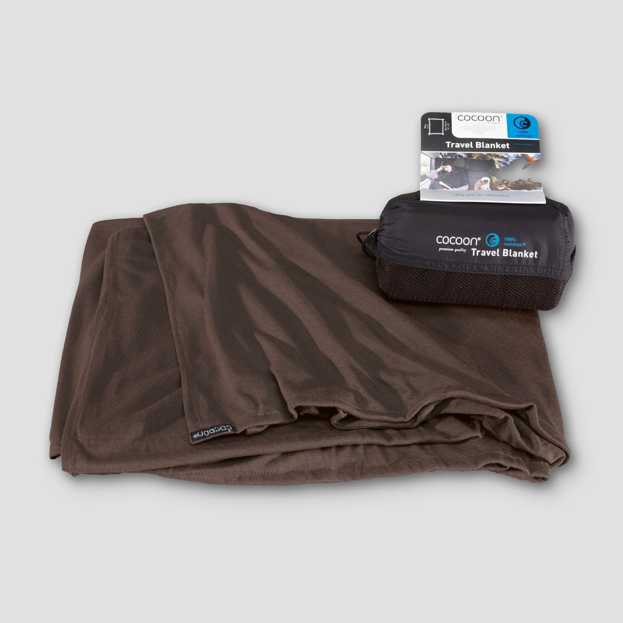 Brown travel blanket with packaging on a light gray background