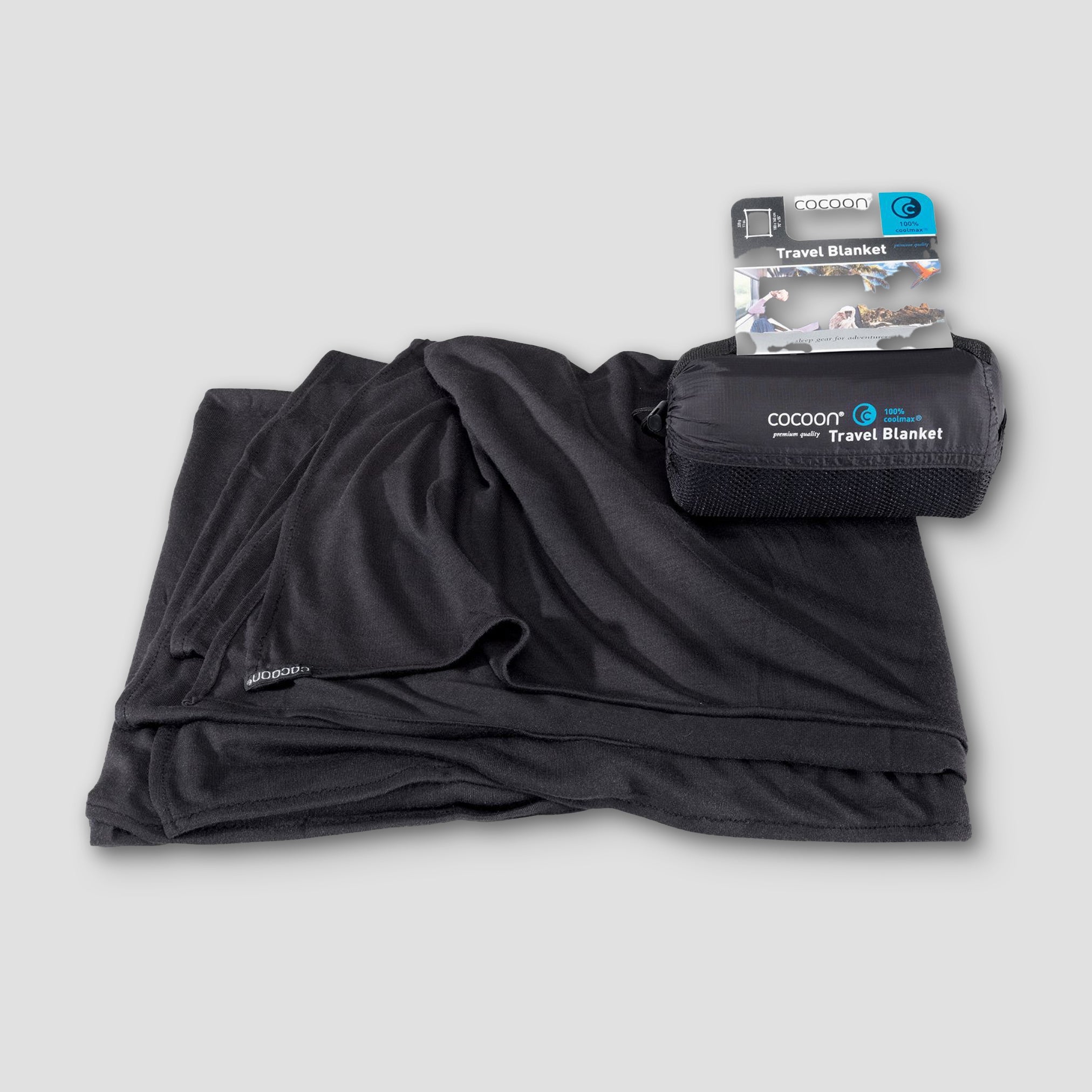 Black travel blanket with packaging on a light gray background