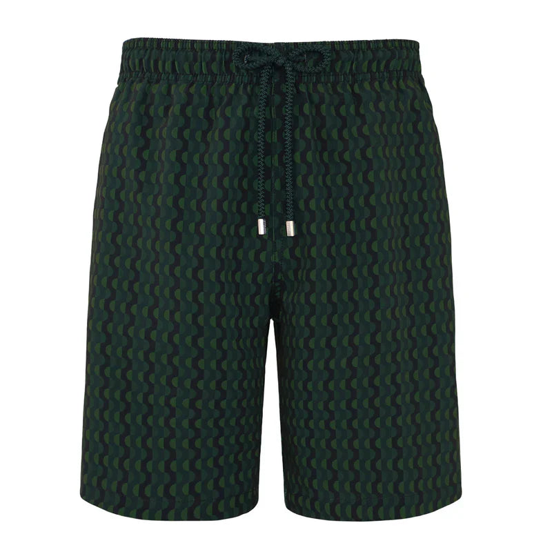 Green patterned shorts on a white background