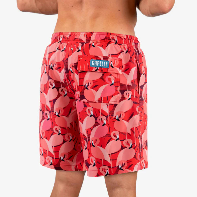 Red flamingo patterned shorts with a brand label on a white background