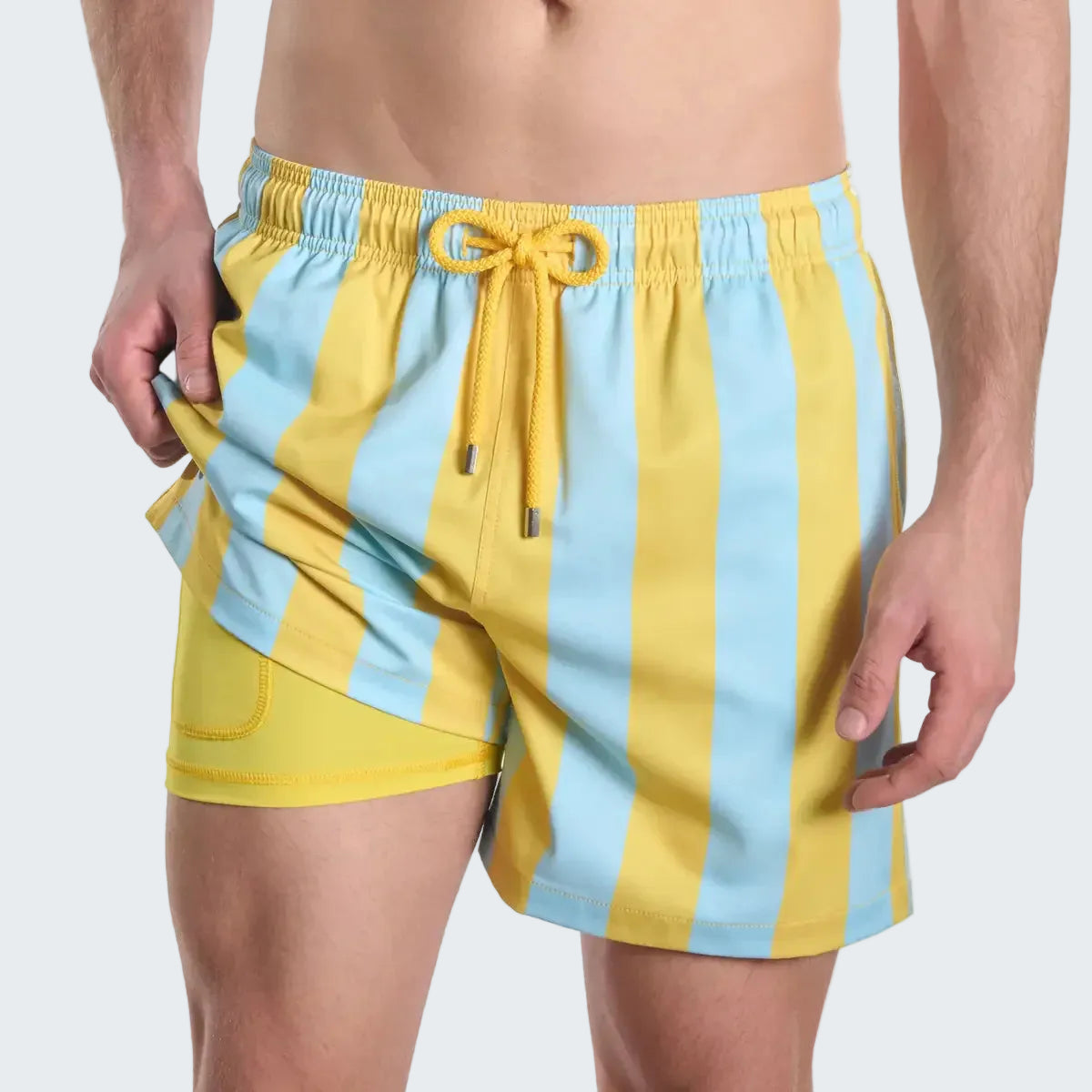 Yellow and light blue striped swim shorts on a white background