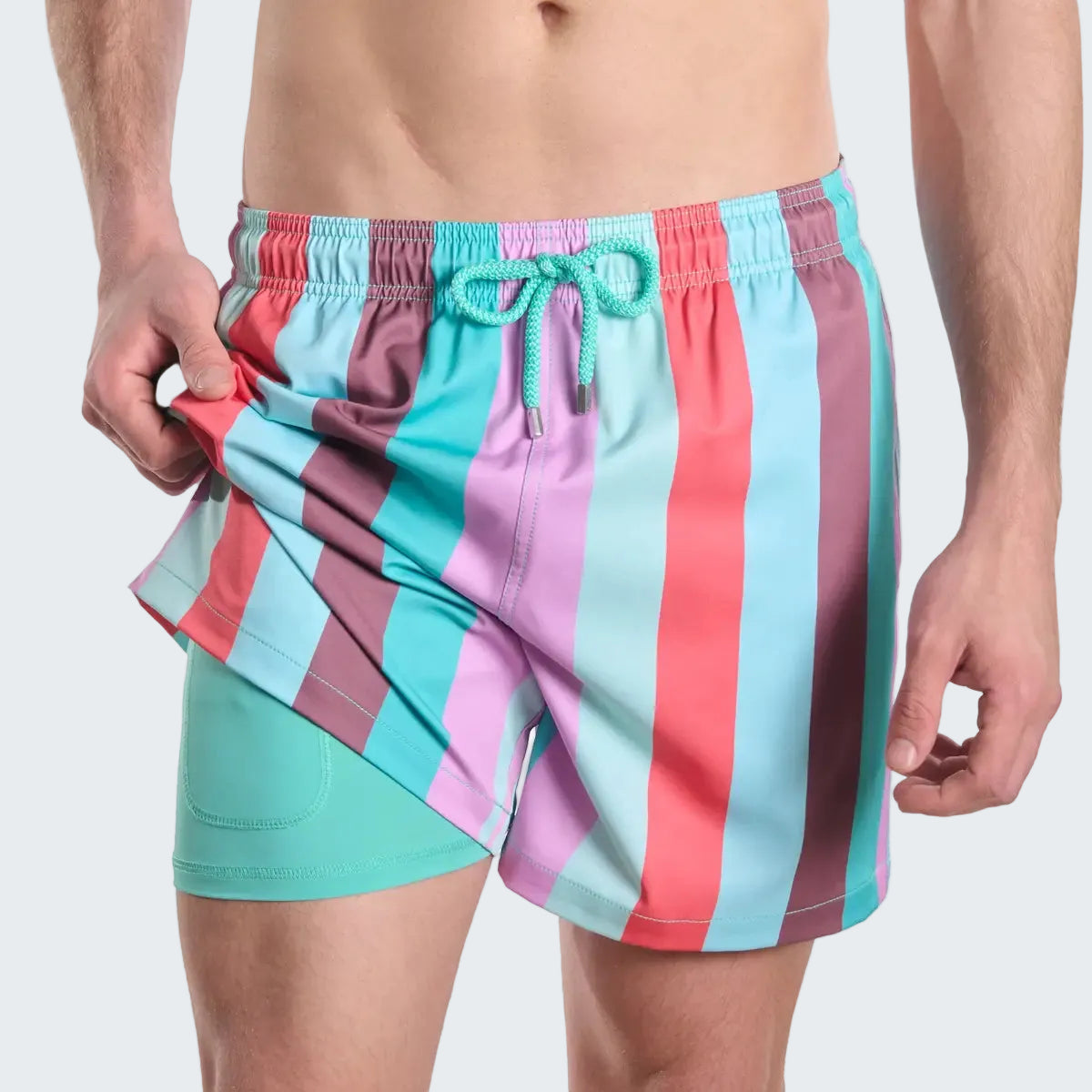 Colorful striped swim shorts on a white background