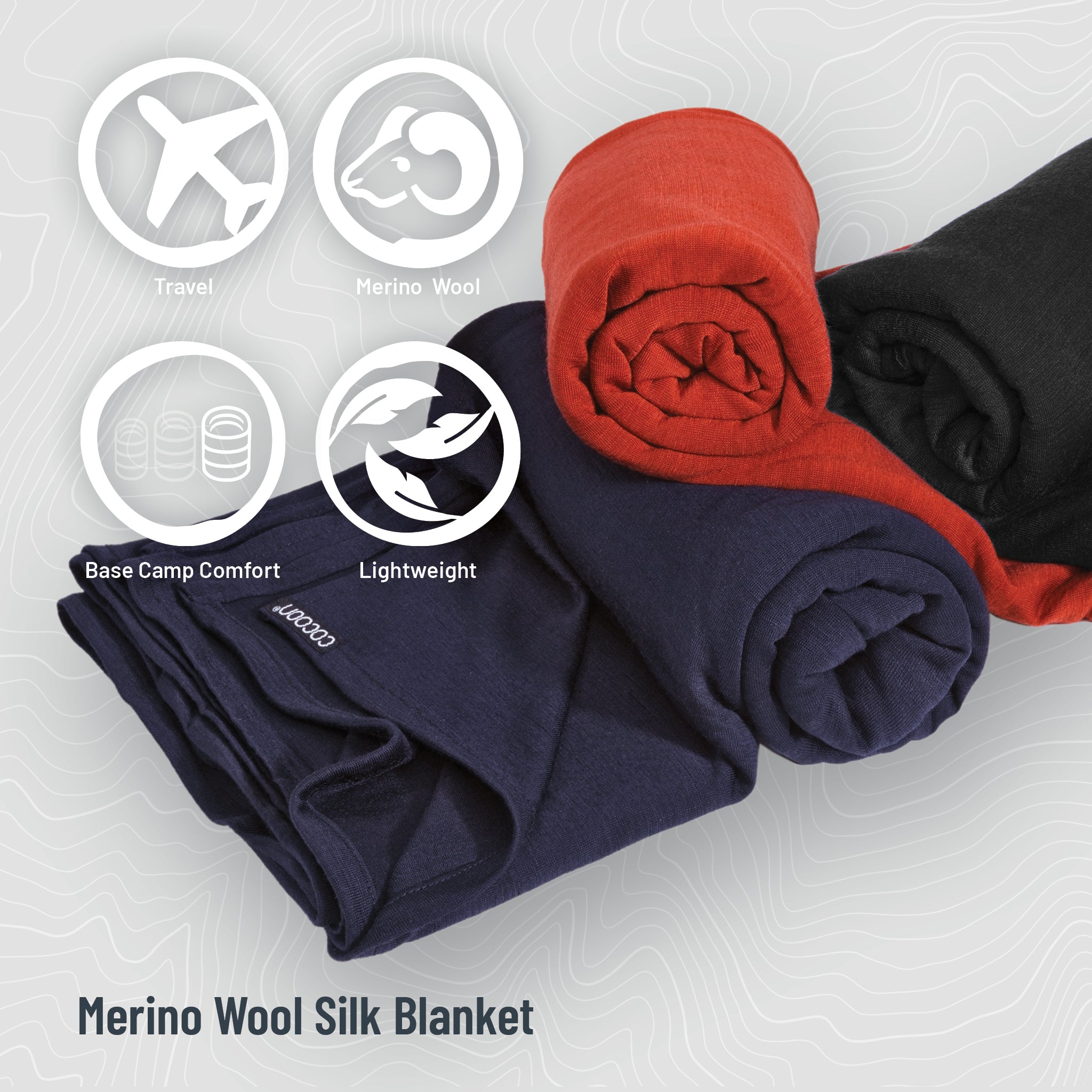 Three rolled-up Merino Wool Silk Blankets in navy, red, and black on a light gray background with icons and text.