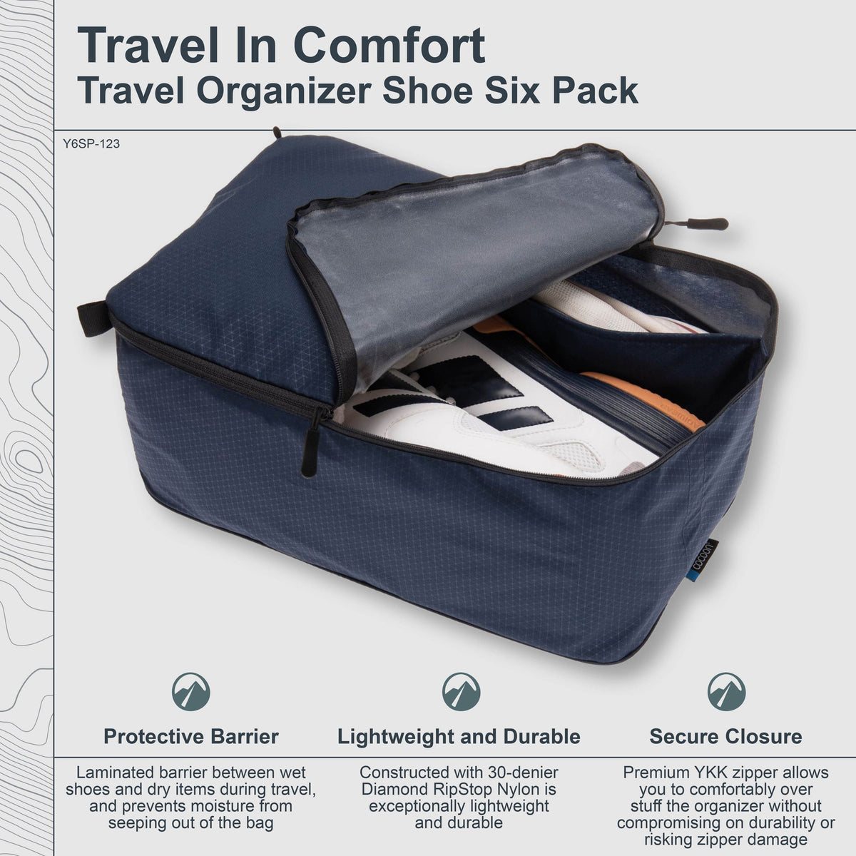 Navy travel organizer shoe six pack with open lid showing shoes, on a light gray background.