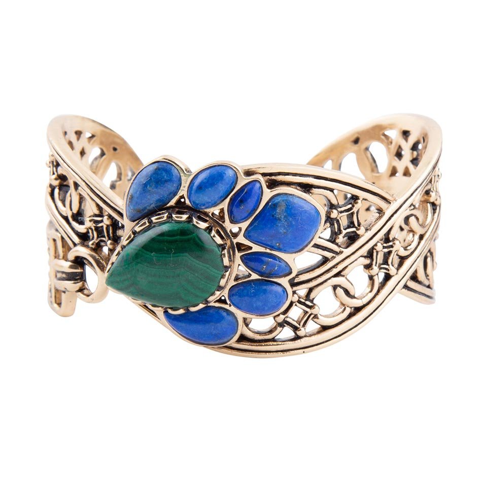 Decorative bracelet with blue and green stones on a white background