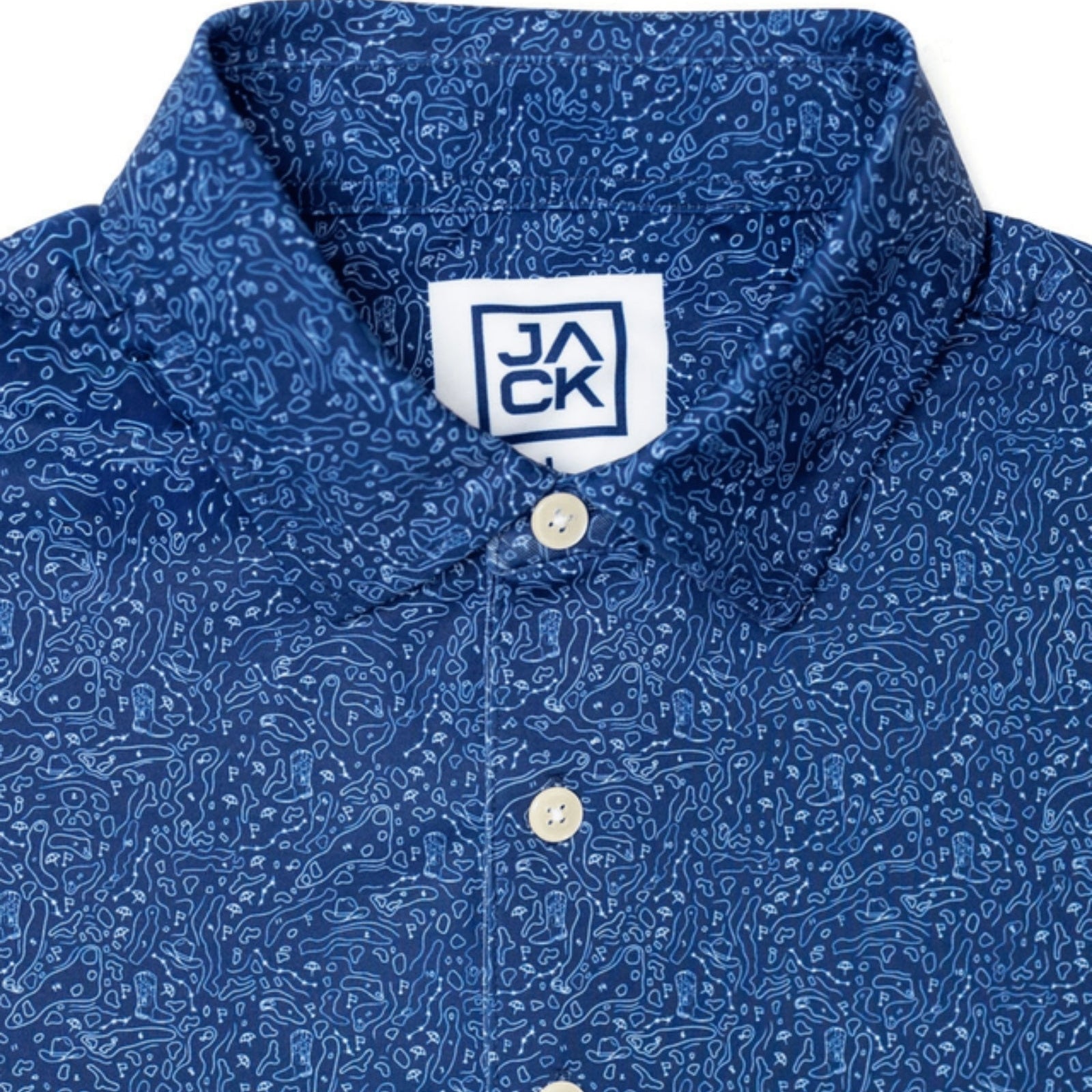 Close-up of a blue collared button-up shirt with an intricate white paisley pattern, featuring a white neck label with the brand name JACK.