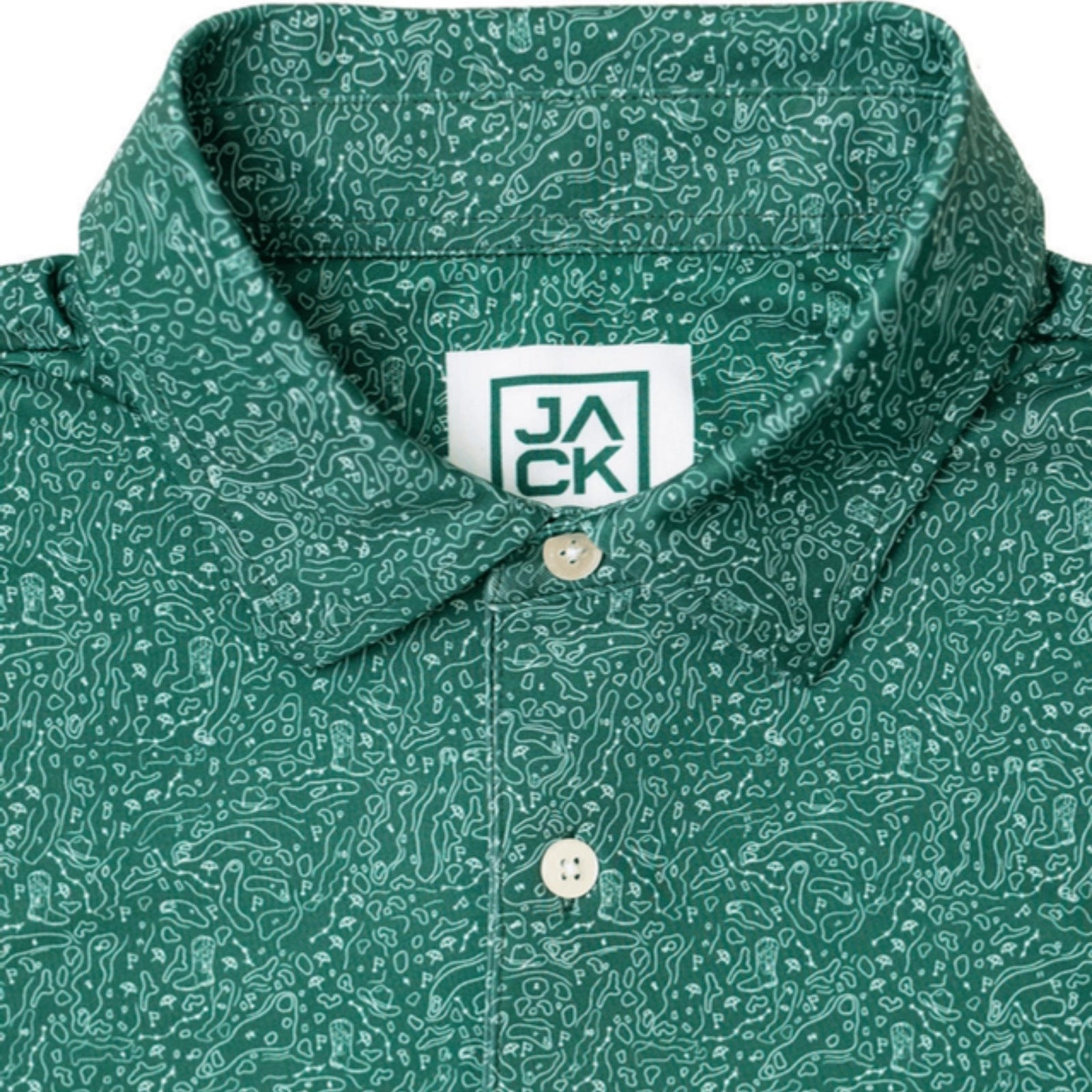 Close-up of a green short-sleeve button-down shirt with an abstract white pattern, featuring a white collar label with the brand name 'JACK' and white buttons.