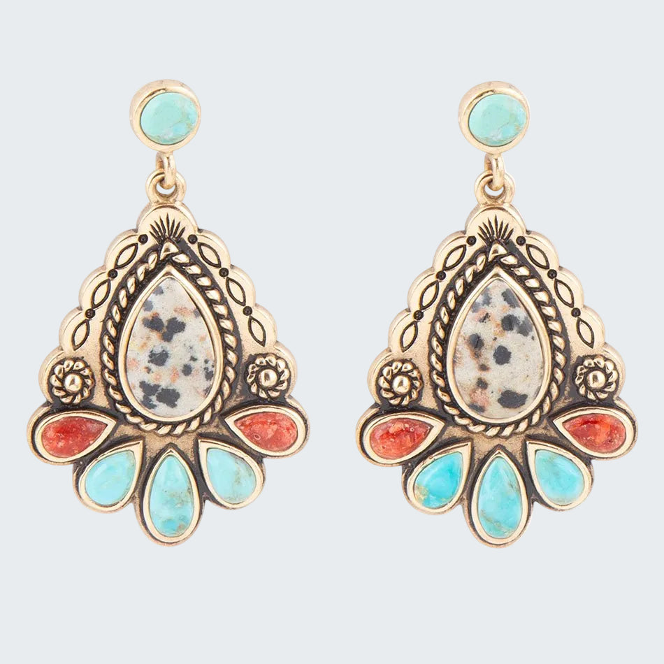 Ornate earrings with turquoise and red stones on a white background