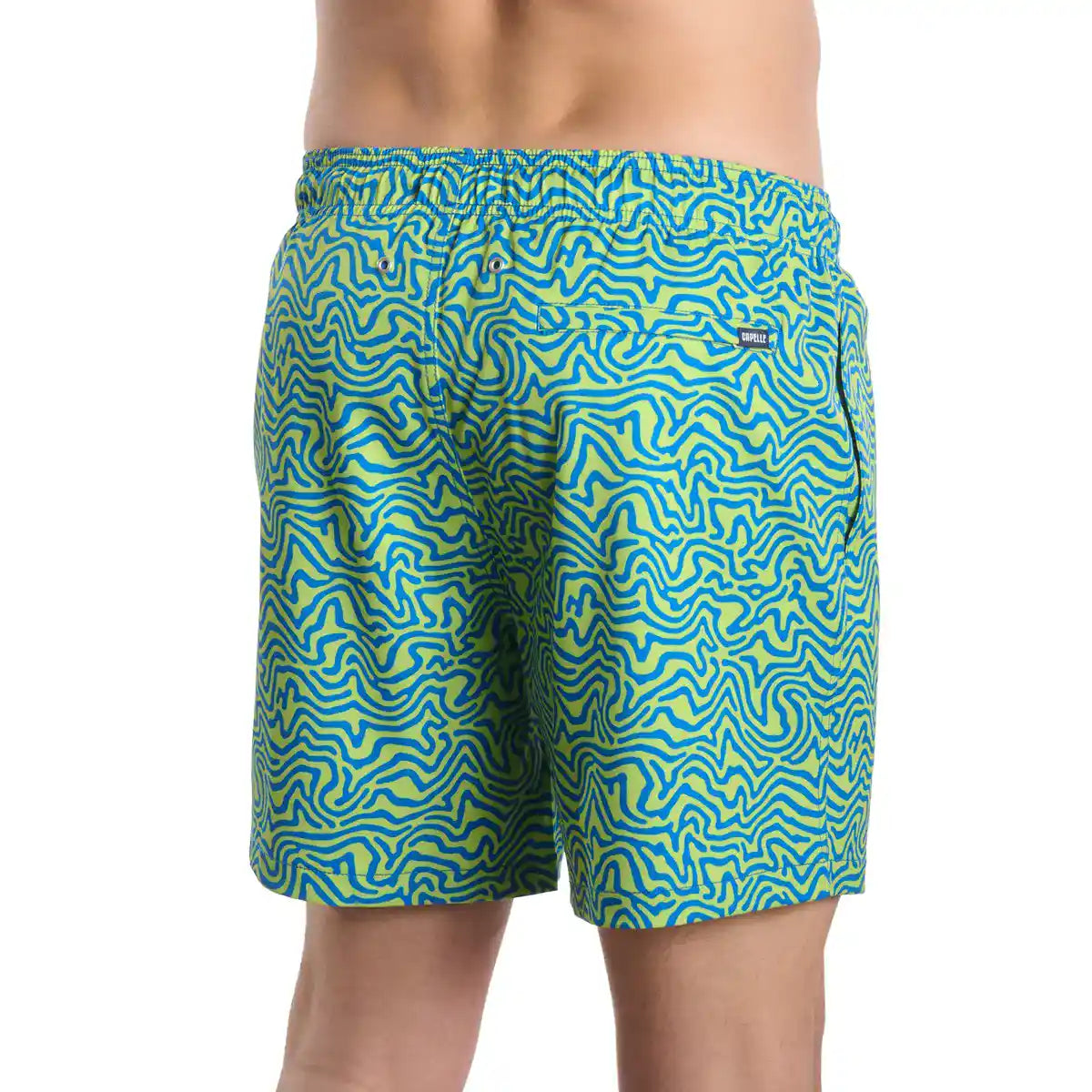 Green and blue patterned swim shorts on a white background