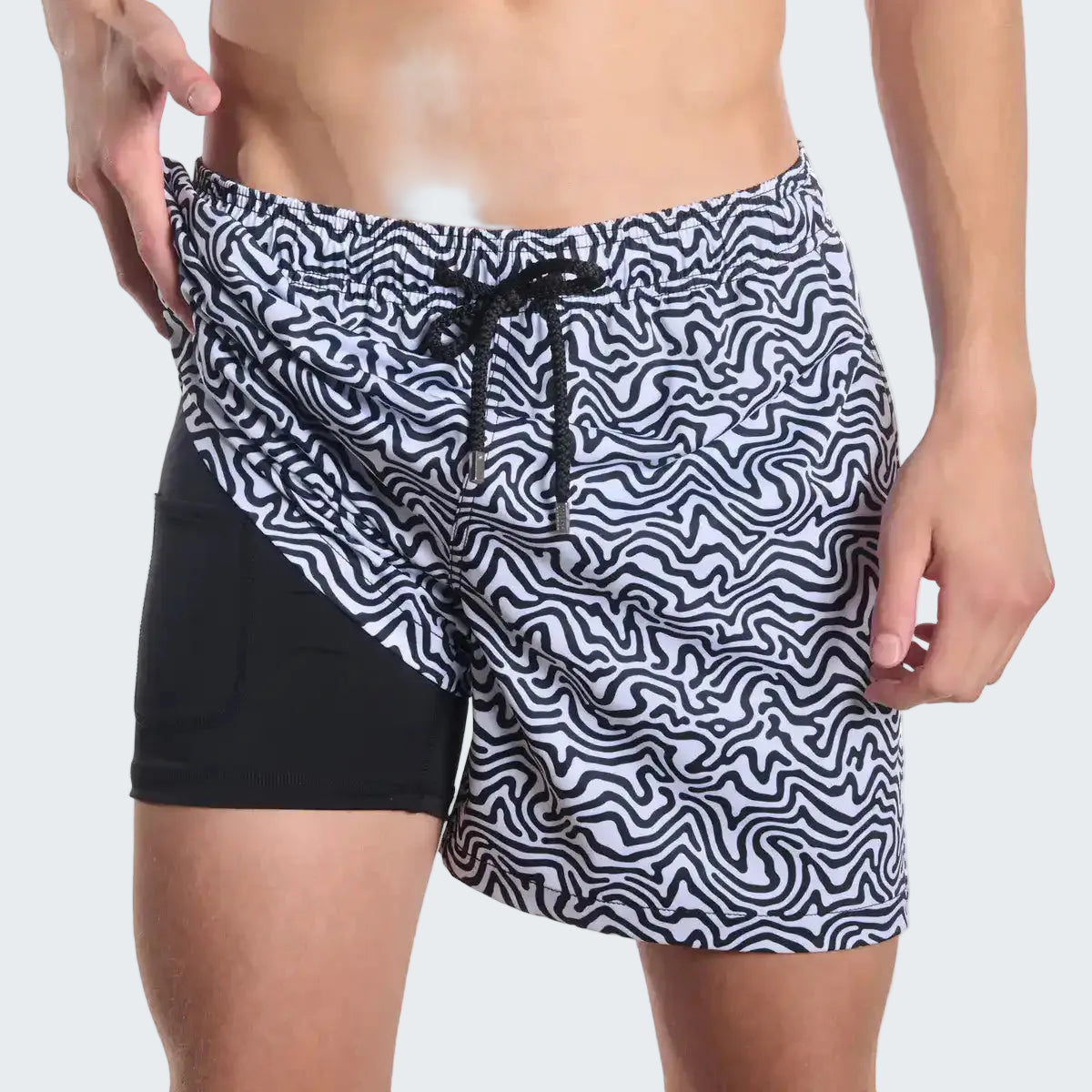 Black and white patterned shorts with a drawstring on a white background
