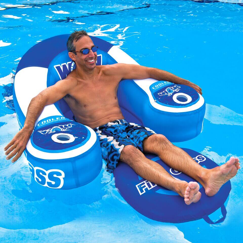 Man lounging on a blue inflatable pool float with 'Floss' branding in a pool.