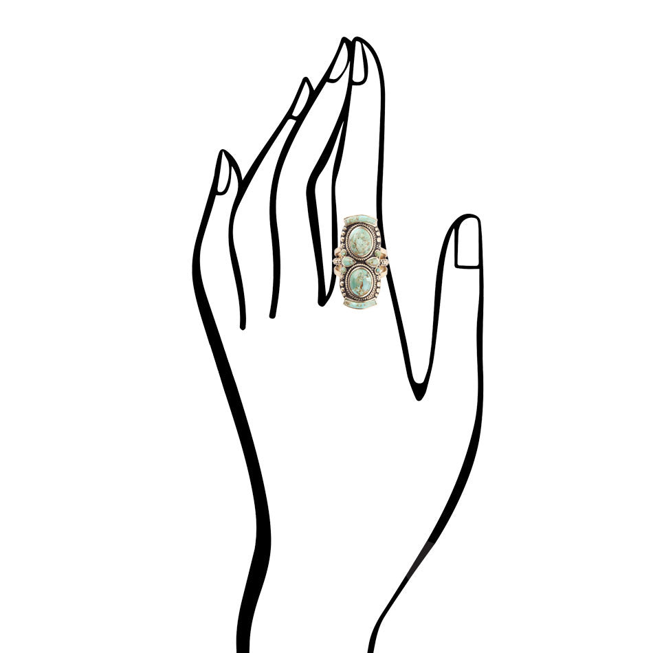 Line drawing of a hand wearing a ring with a green gemstone on a white background