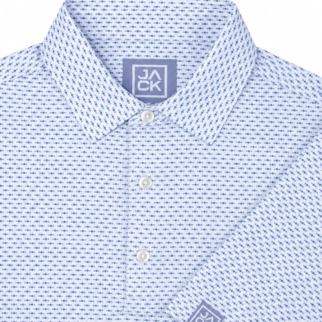 A close-up of a light blue and white micro-patterned button-down shirt by Jack CK, showing the collar, front buttons, and a matching brand patch on the cuff.