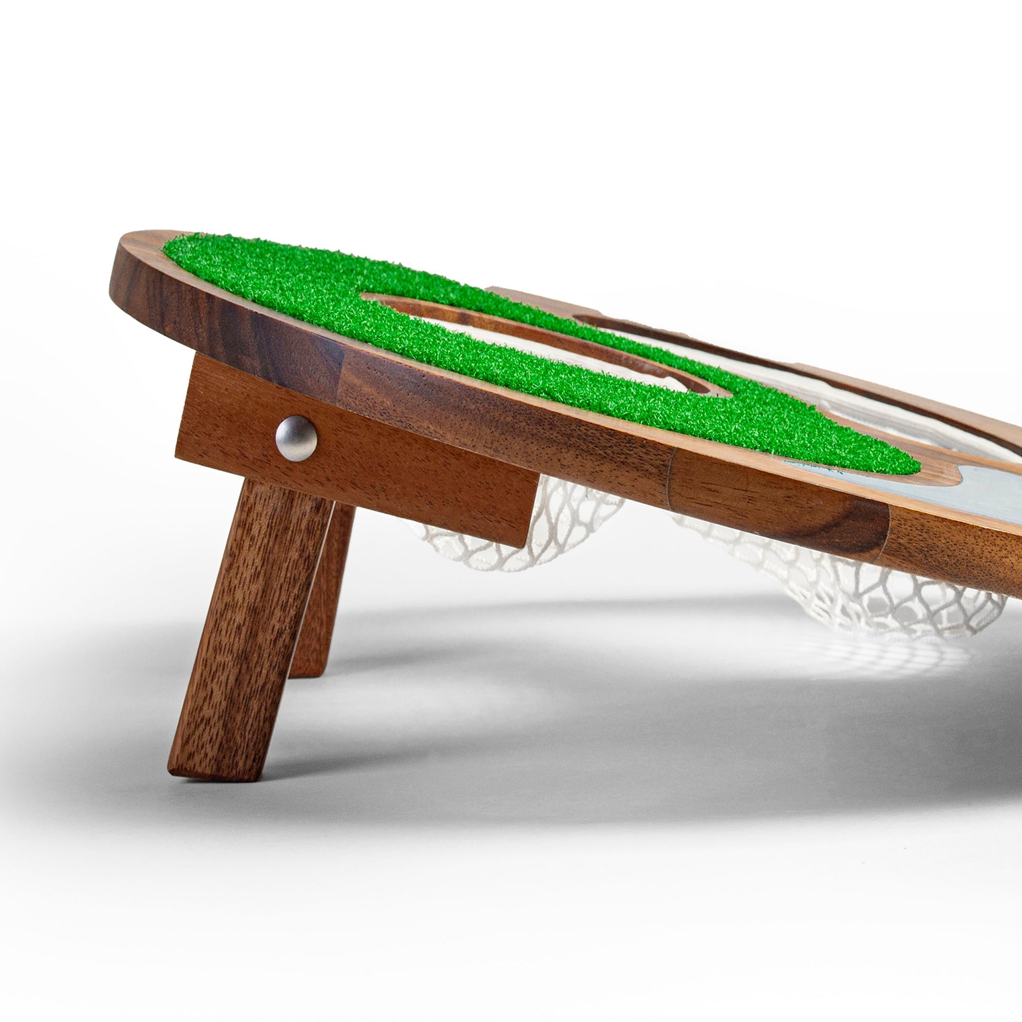Wooden miniature golf course with green playing surface on a white background