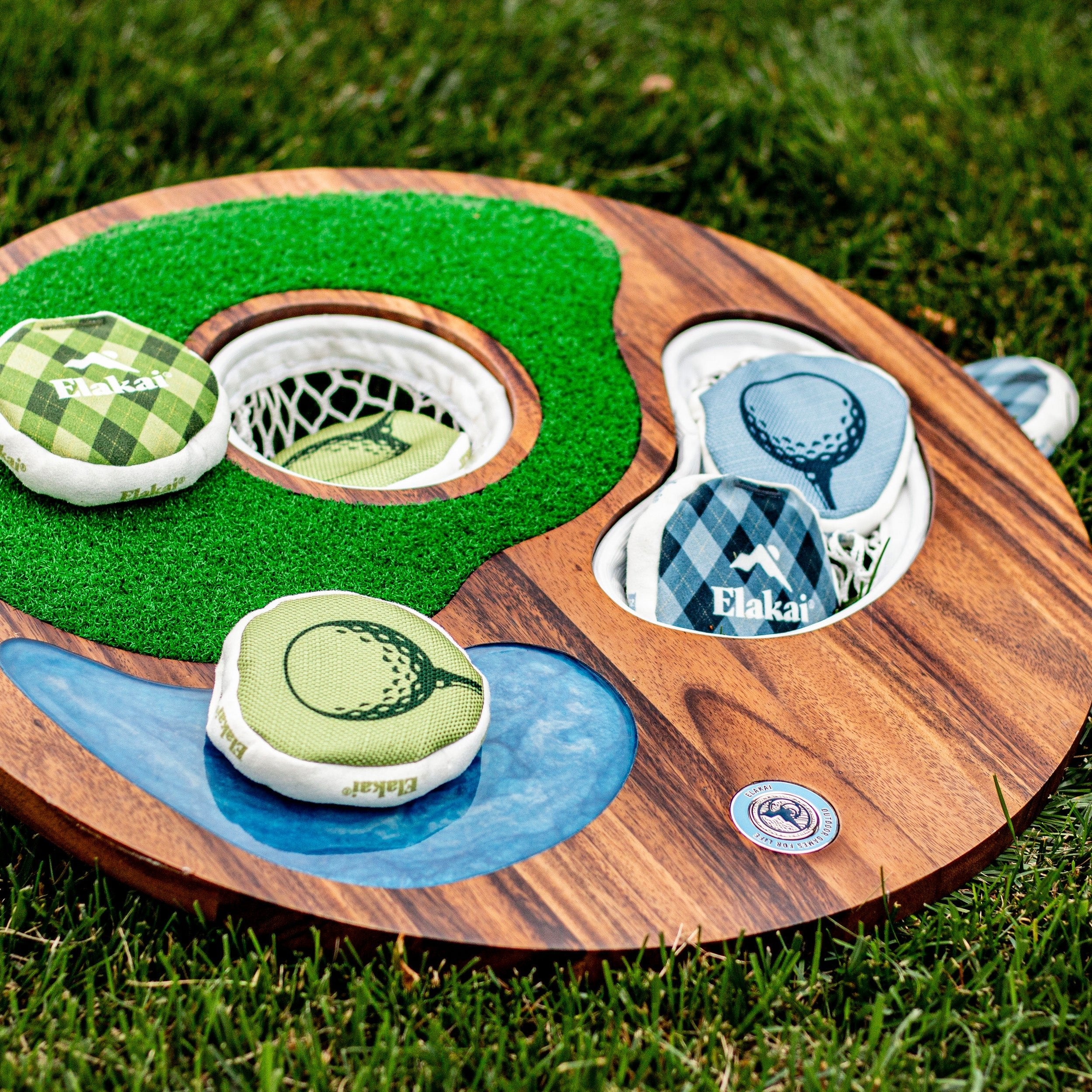 Wooden mini golf course toy set on grass