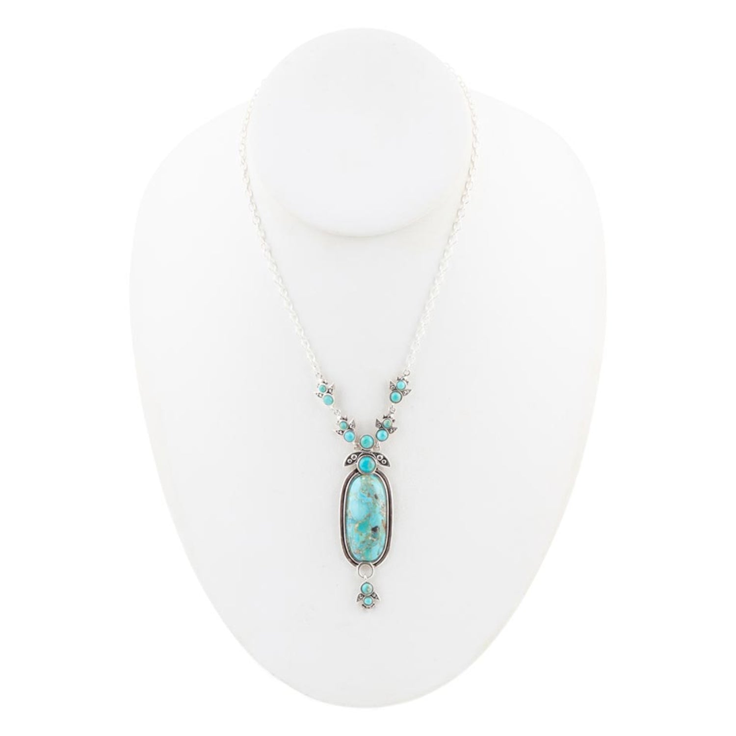 Turquoise necklace on a white mannequin bust