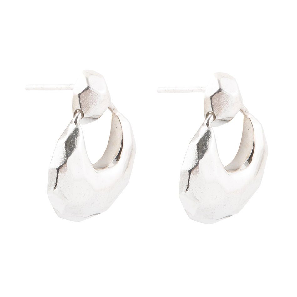Pair of silver hoop earrings on a white background