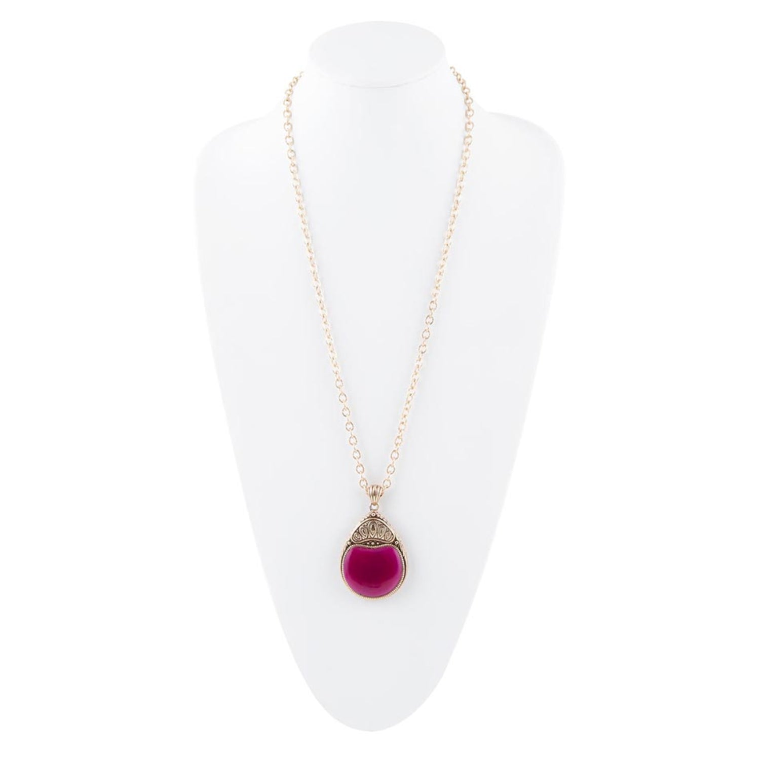 Necklace with a pink pendant on a white stand
