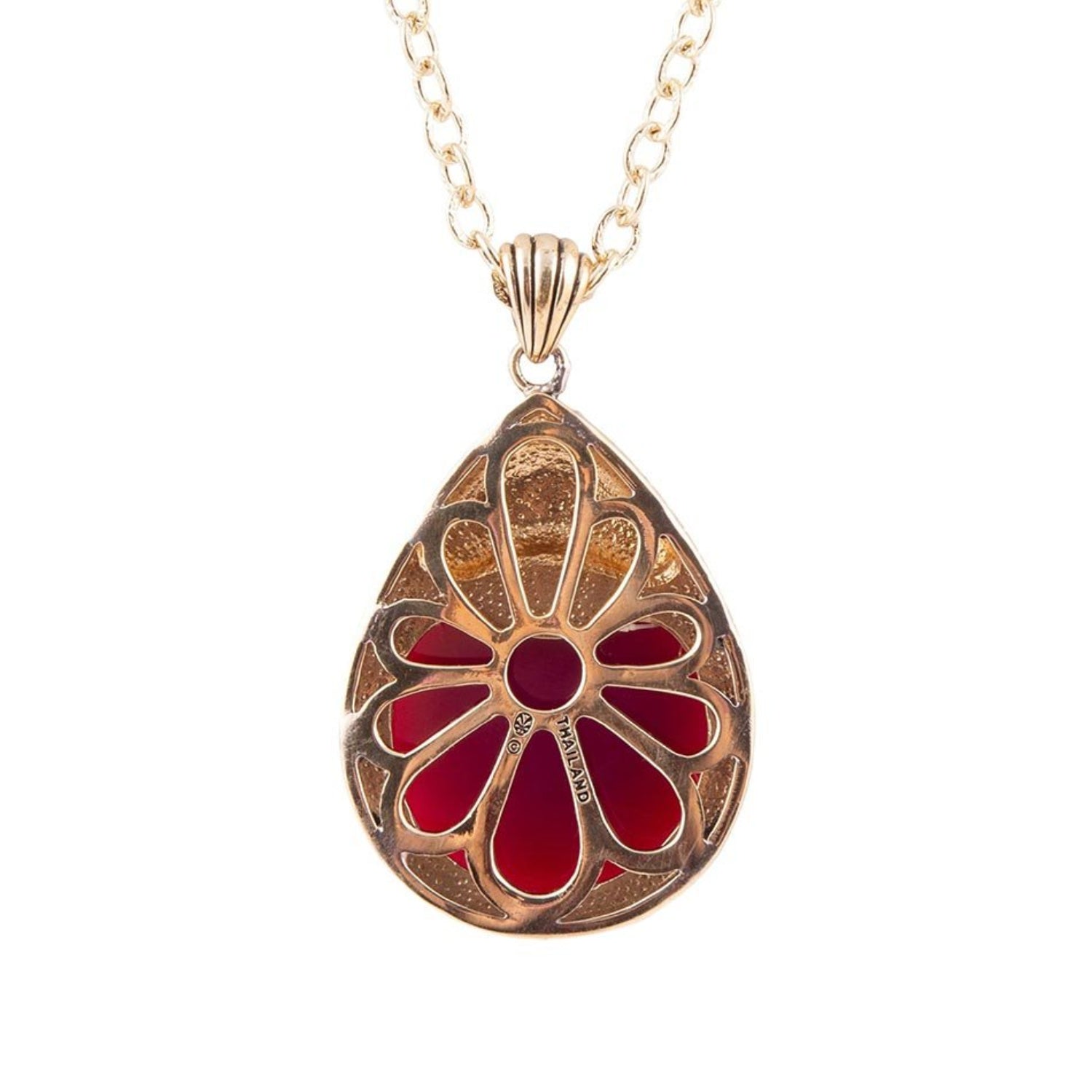 Gold and red pendant necklace on a white background