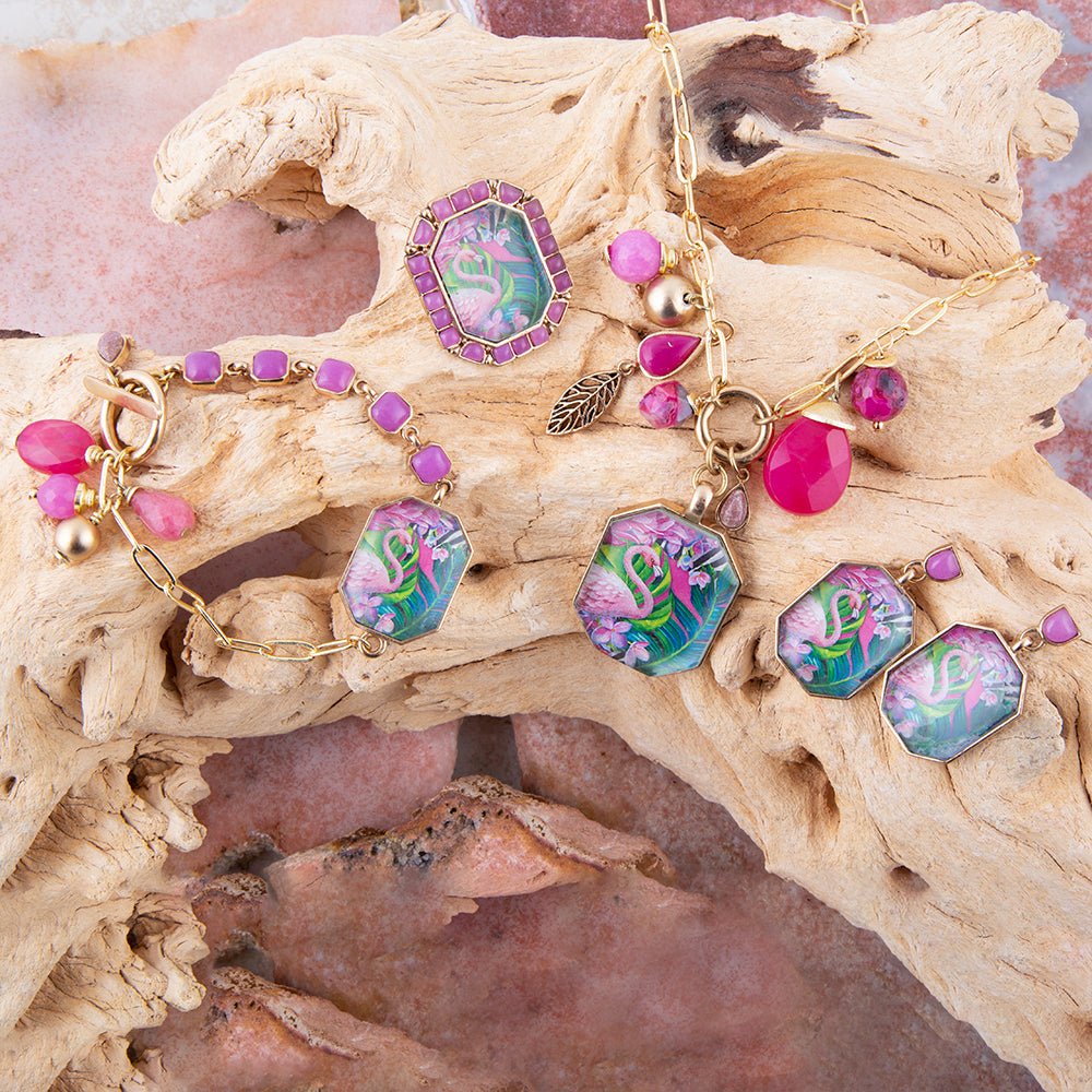 Jewelry set with colorful gemstones on a textured surface