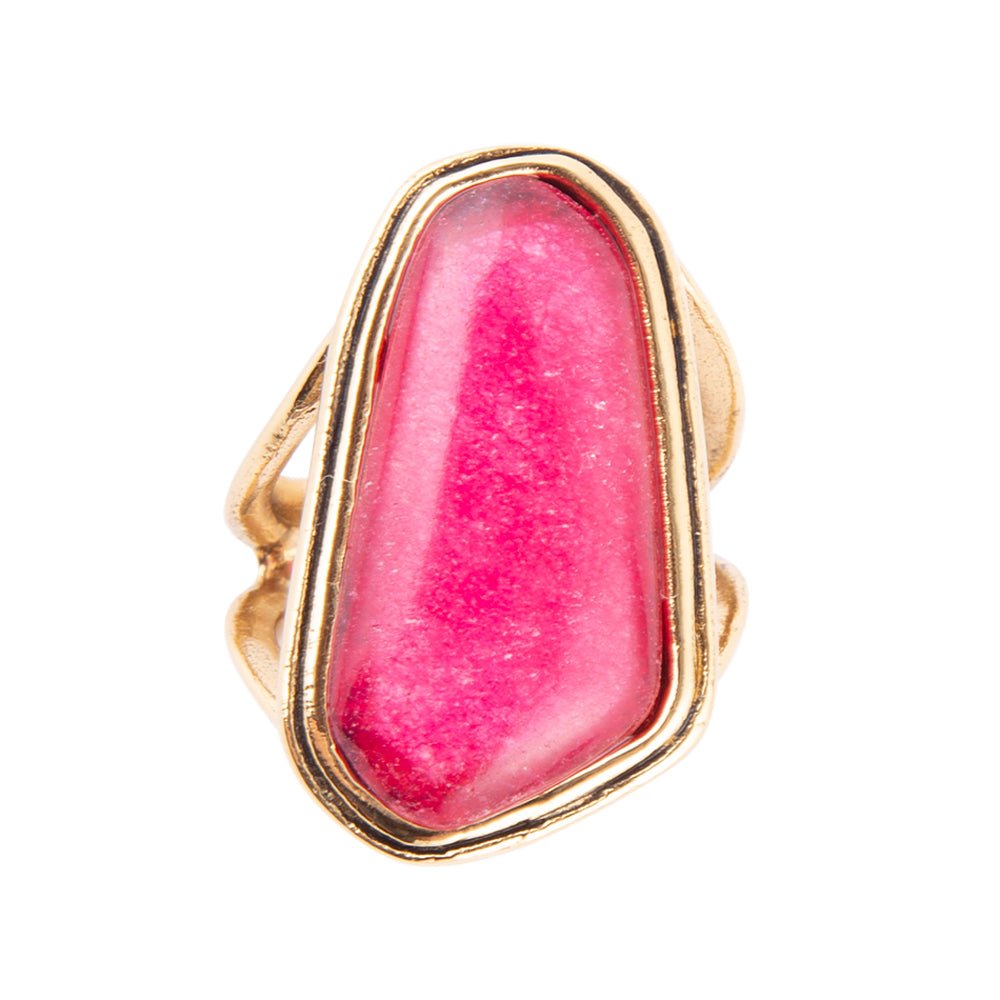 Gold ring with a pink stone on a white background