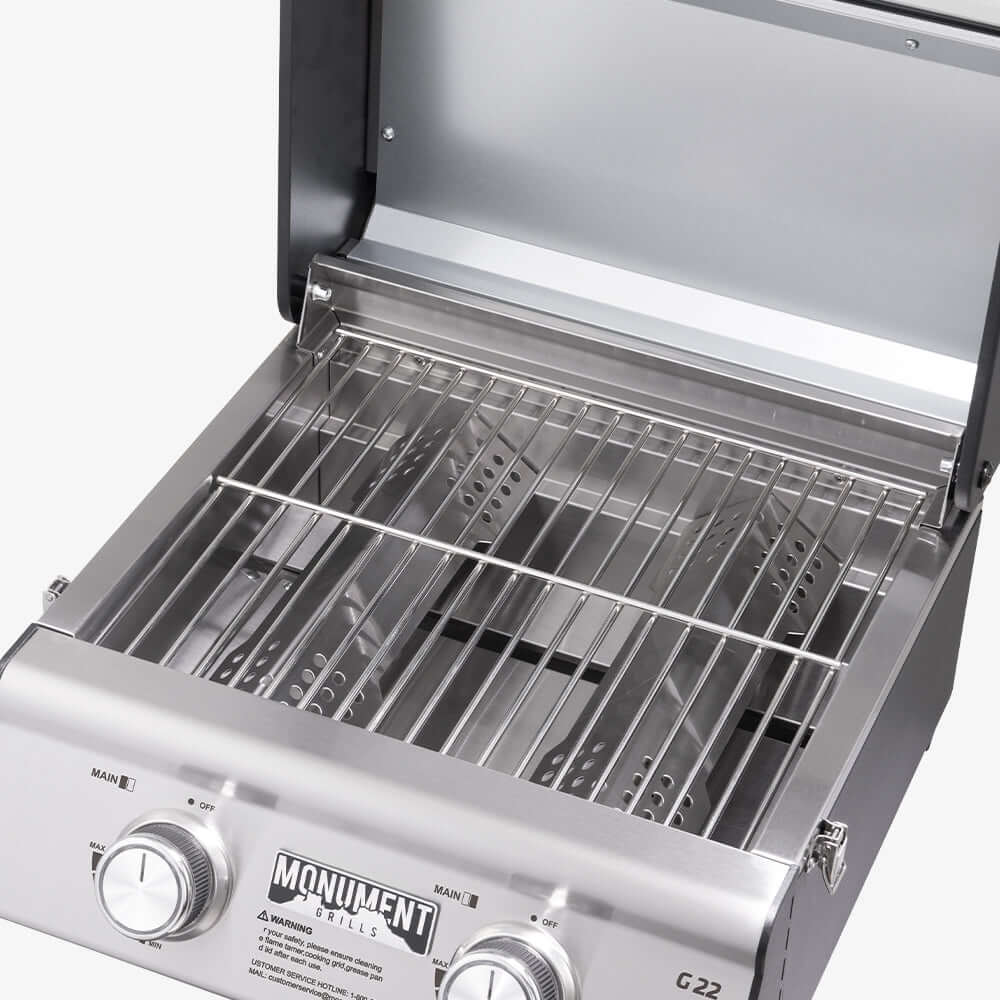 Stainless steel grill with visible brand logo on a white background
