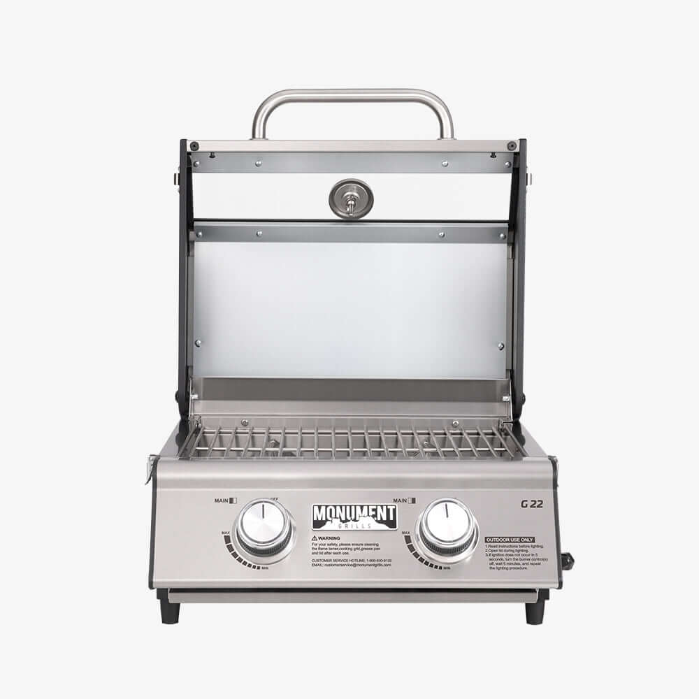 Stainless steel grill with visible brand name on a white background