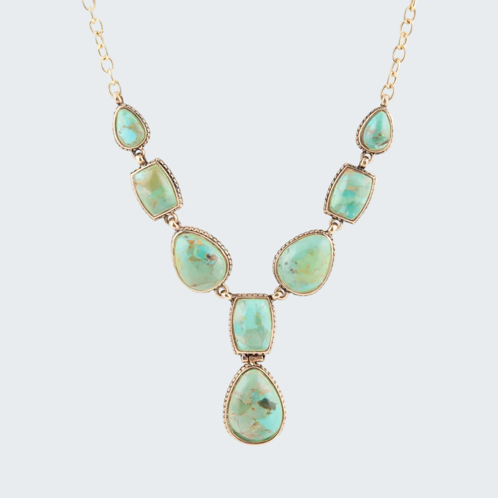 Necklace with turquoise stones on a white background