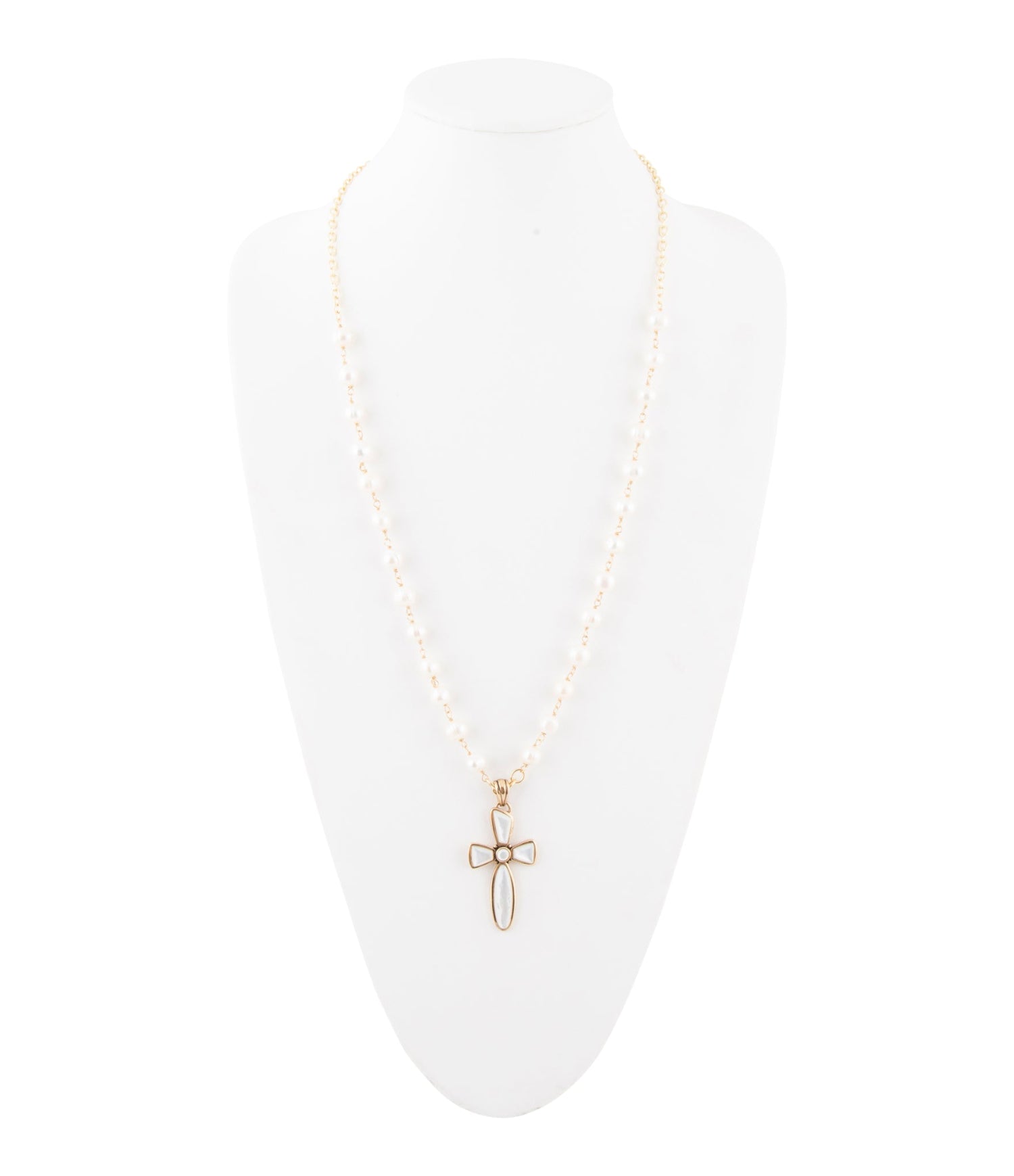 Gold cross necklace on a white background