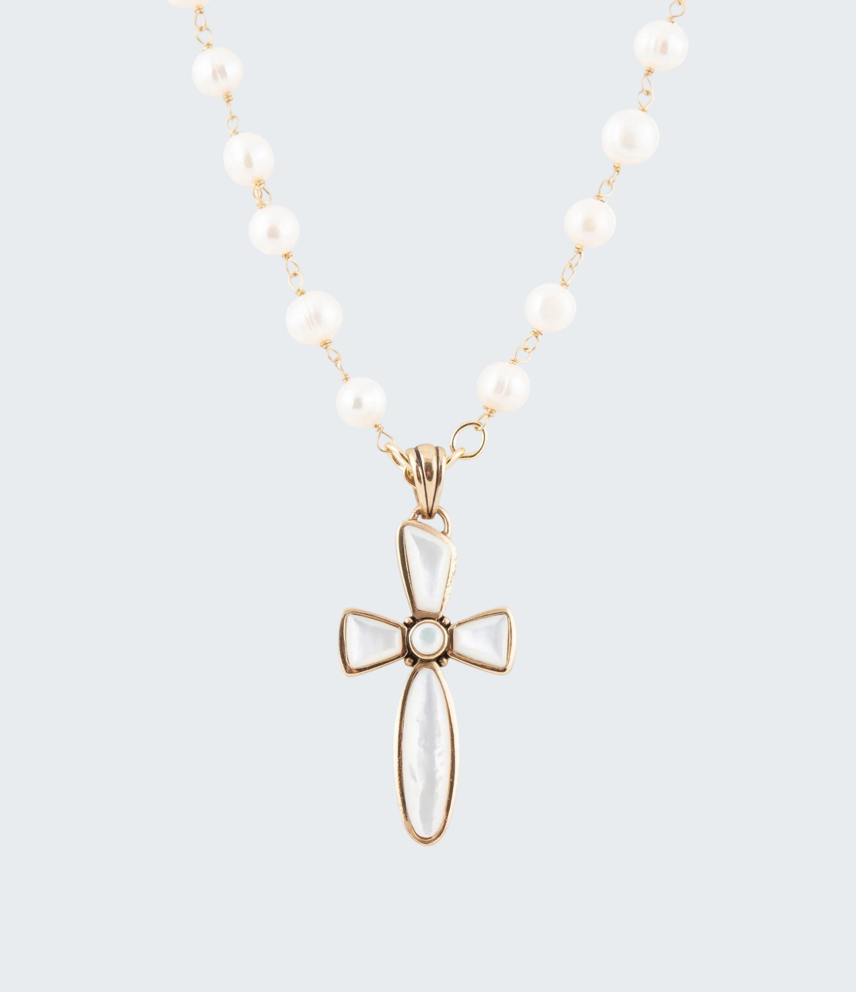 Necklace with a white cross pendant on a white background
