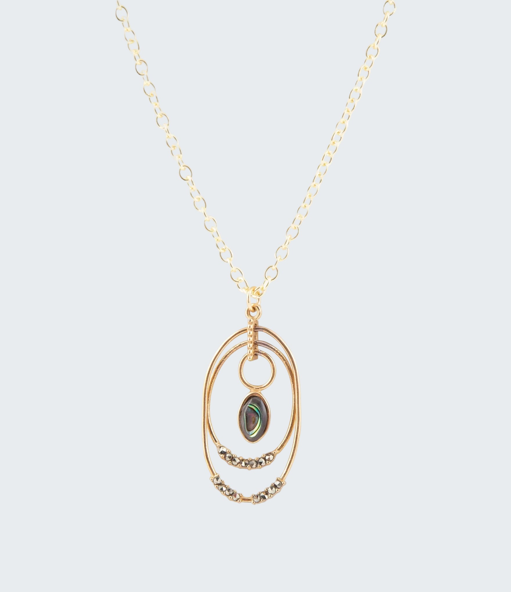 Gold necklace with a pendant on a white background