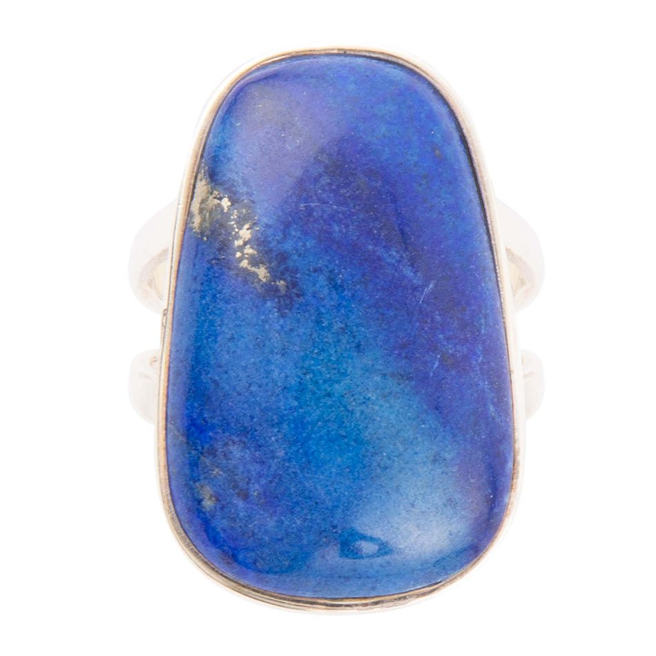 Ring with a large blue stone on a white background