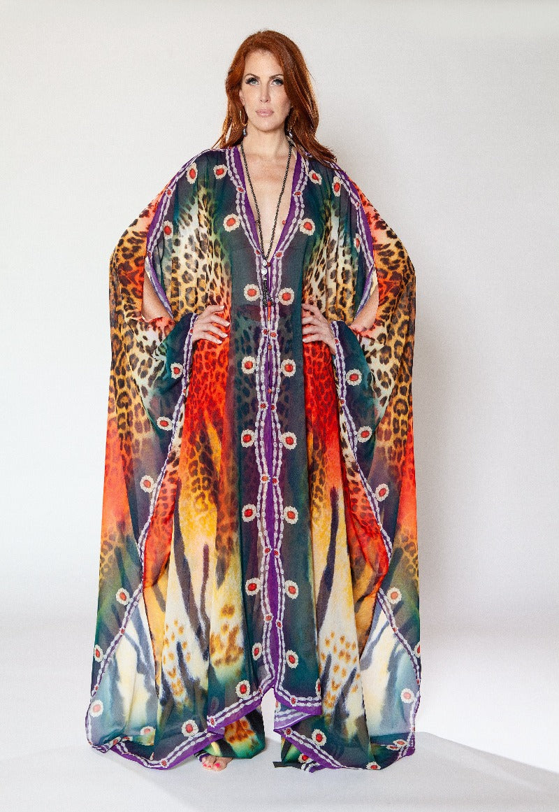 Woman wearing a colorful patterned dress with a white background