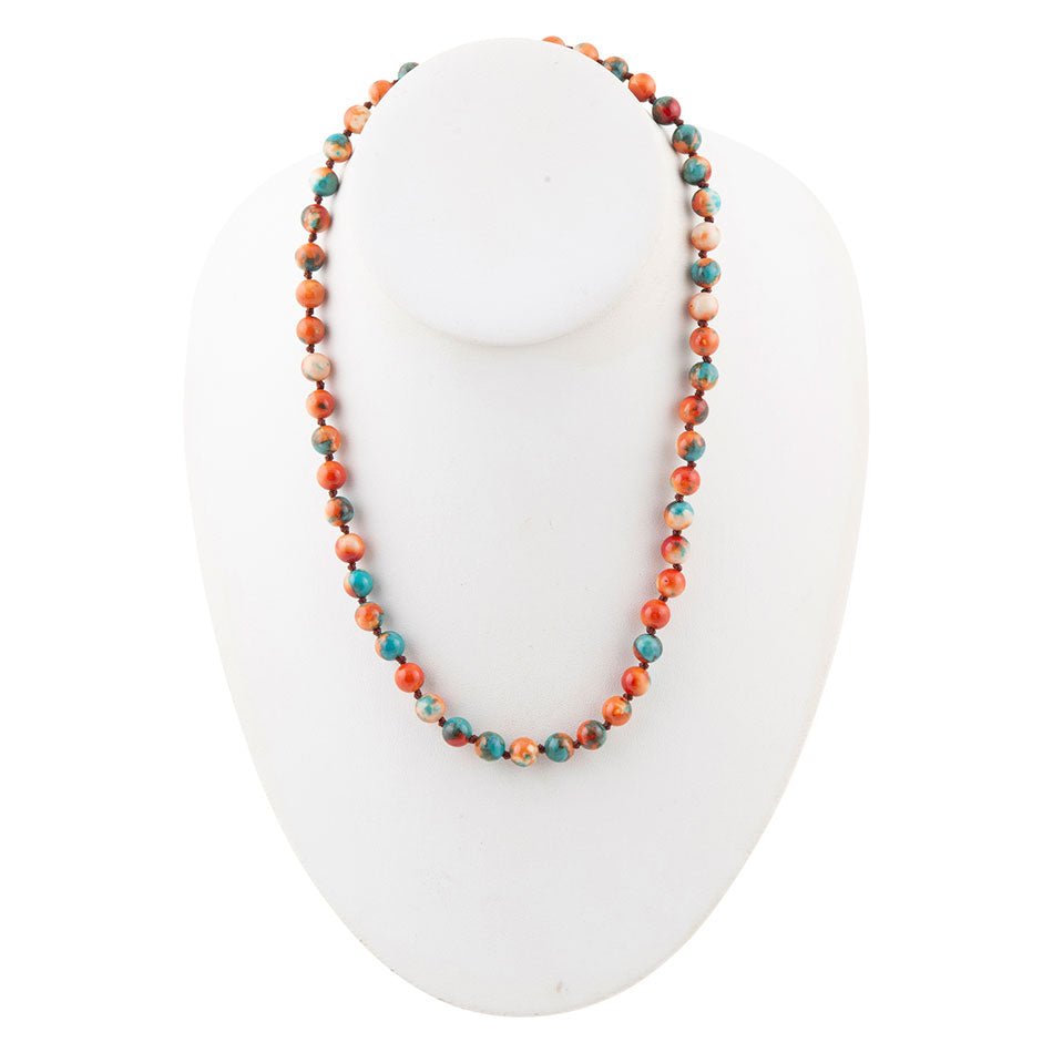 Necklace with multicolored beads on a white mannequin bust