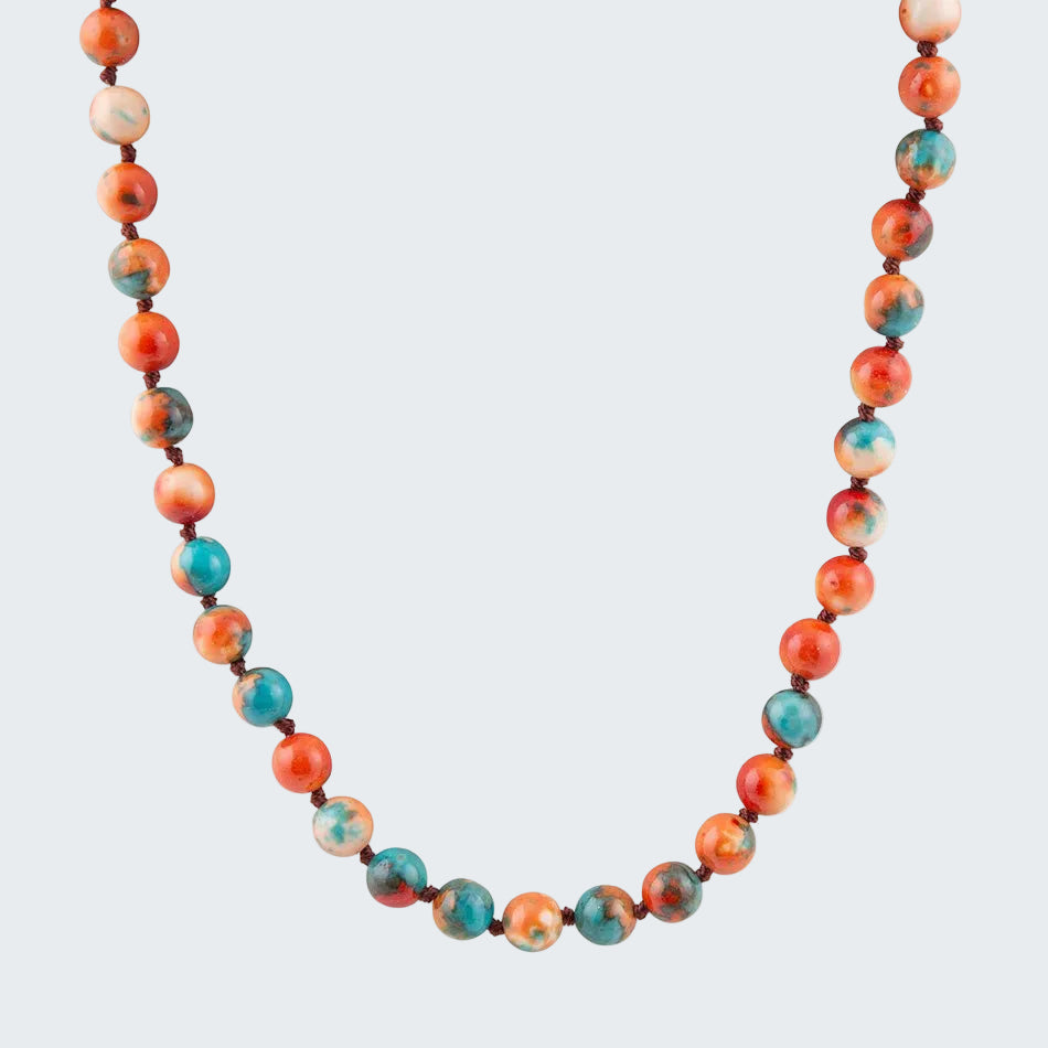 Necklace with multicolored beads on a white background