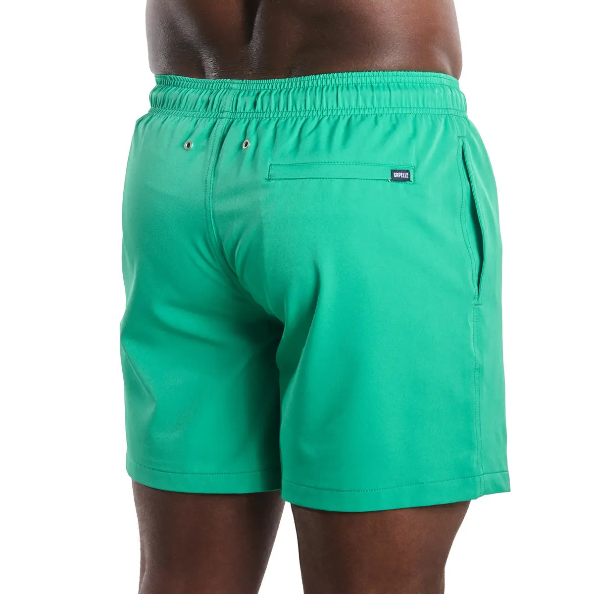 Green swim shorts with a brand logo on a white background