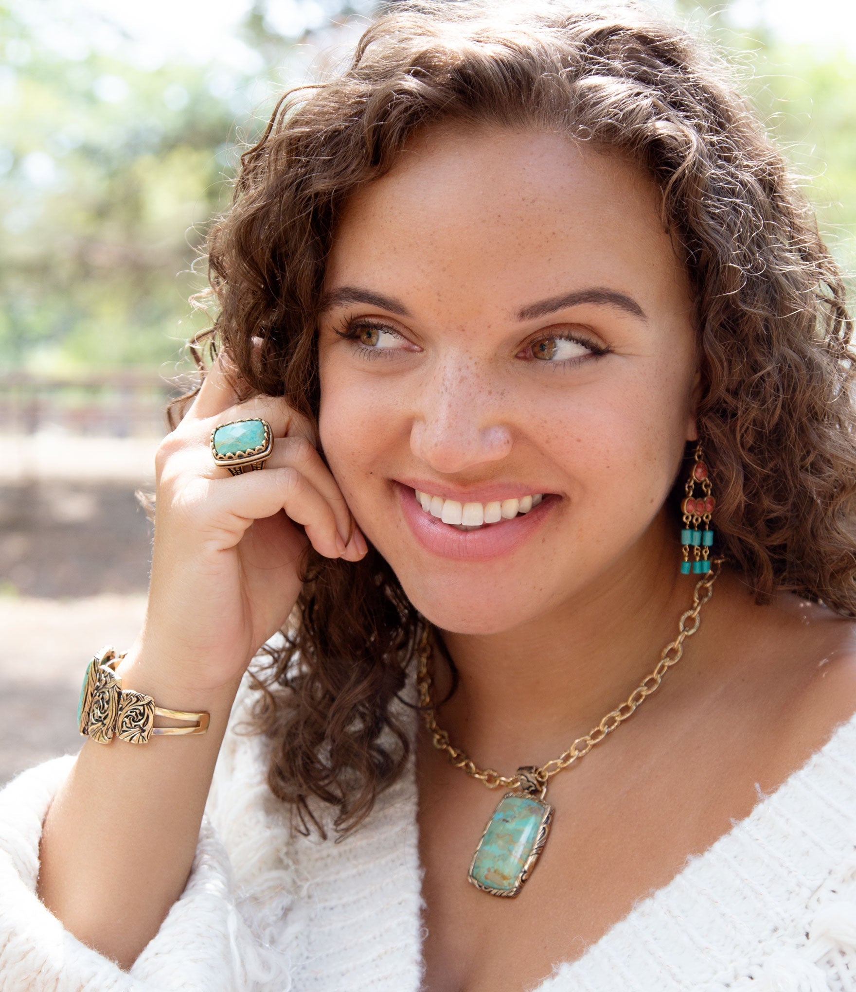 Woman wearing turquoise jewelry outdoors