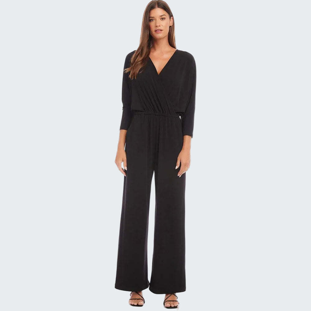 Woman wearing a black jumpsuit on a white background