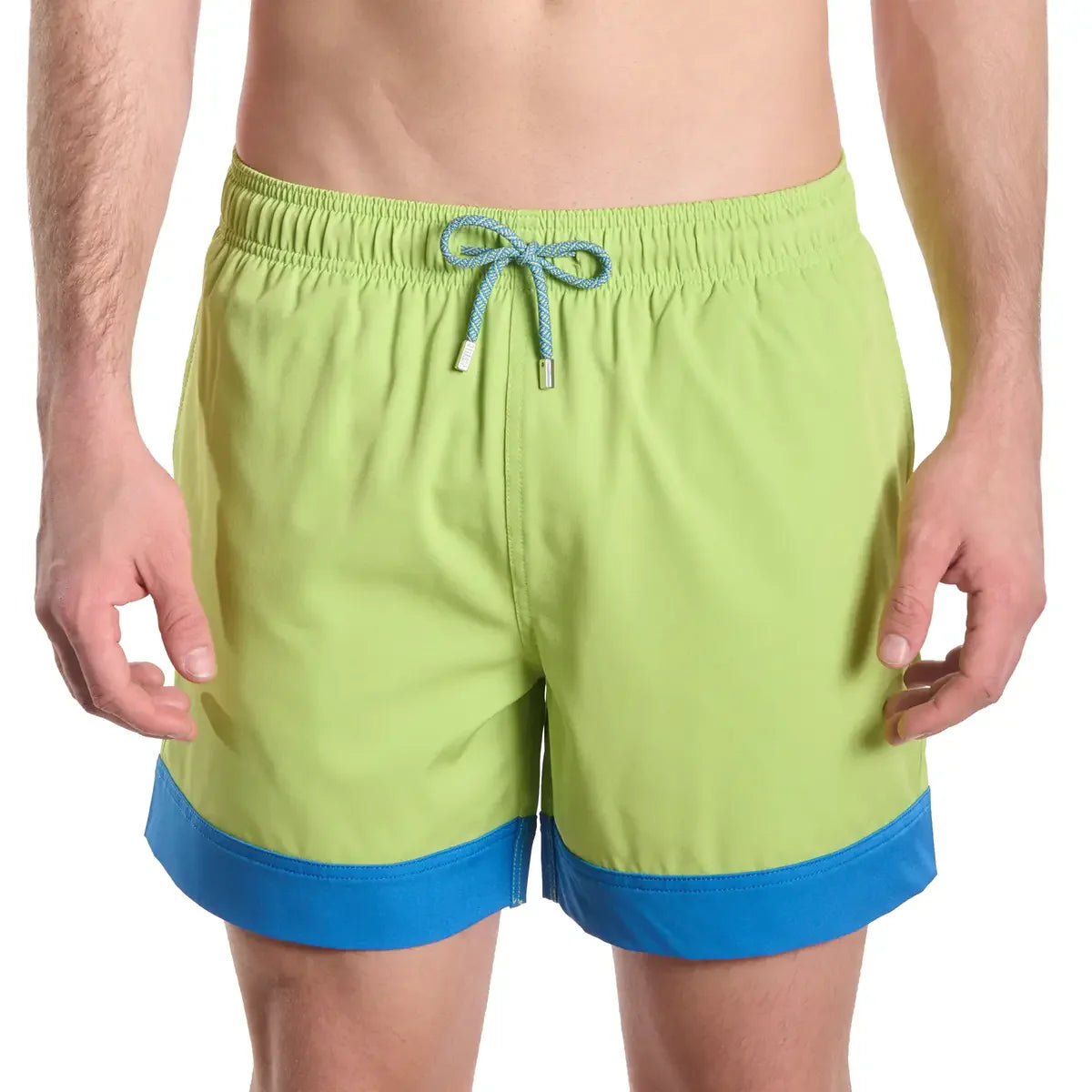 Green and blue swim shorts on a white background