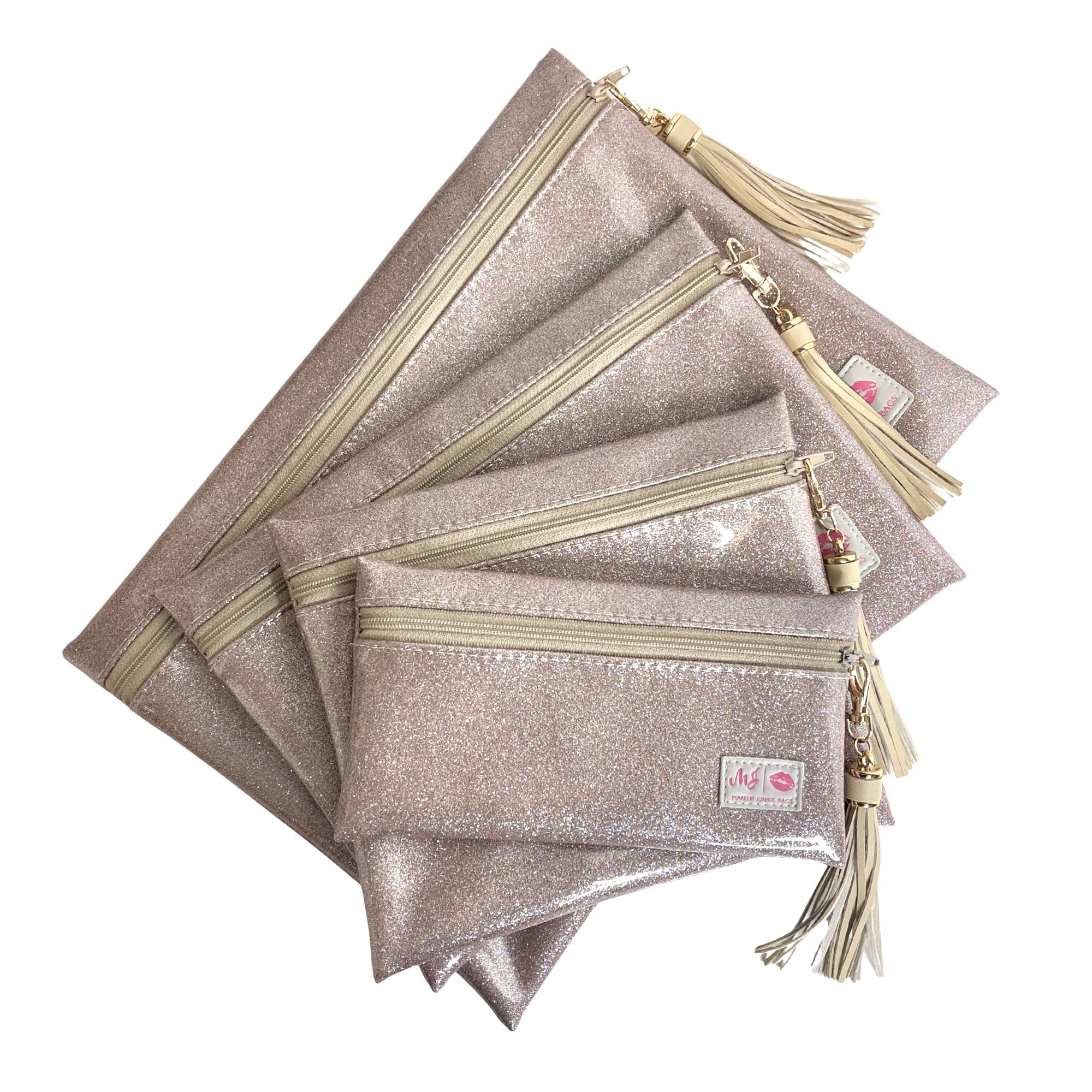 Set of glittery pouches with zippers and tassels on a white background