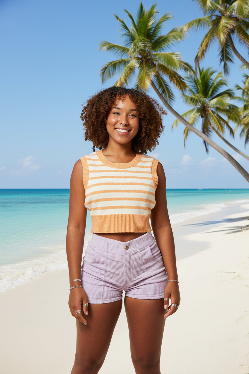 Woman wearing a striped sleeveless top and shorts on a white background