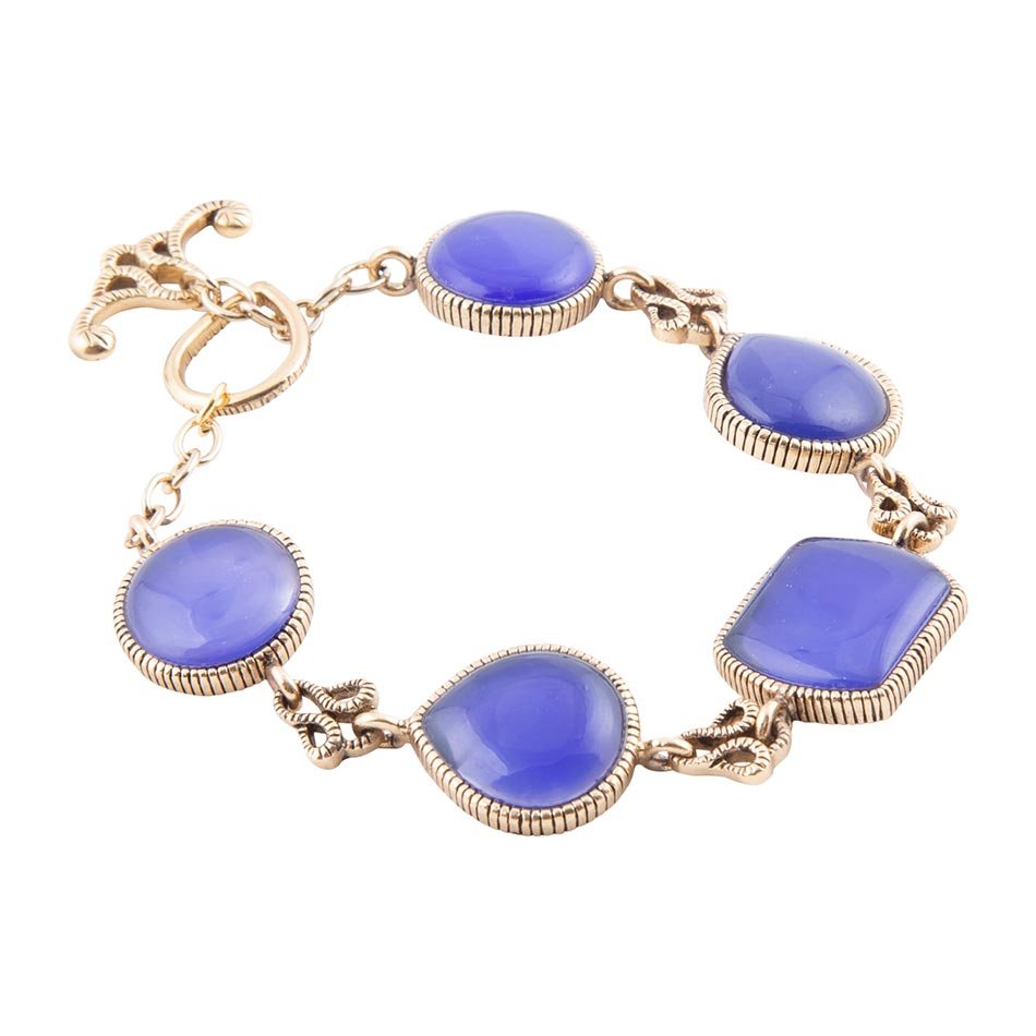 Gold bracelet with purple stones on a white background