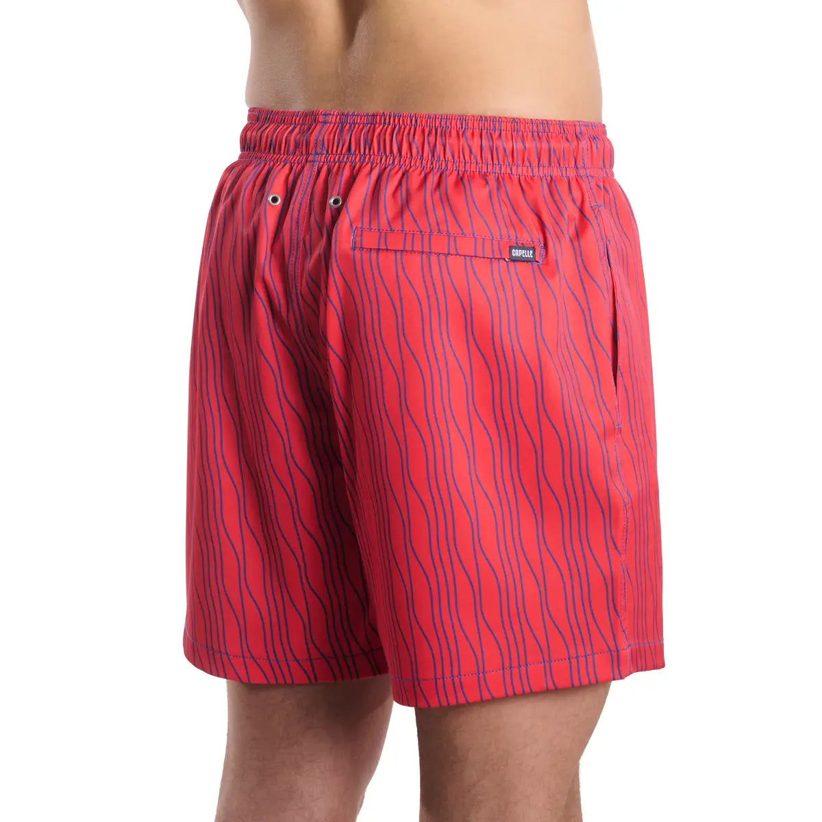Red swim shorts with black wavy pattern on a white background