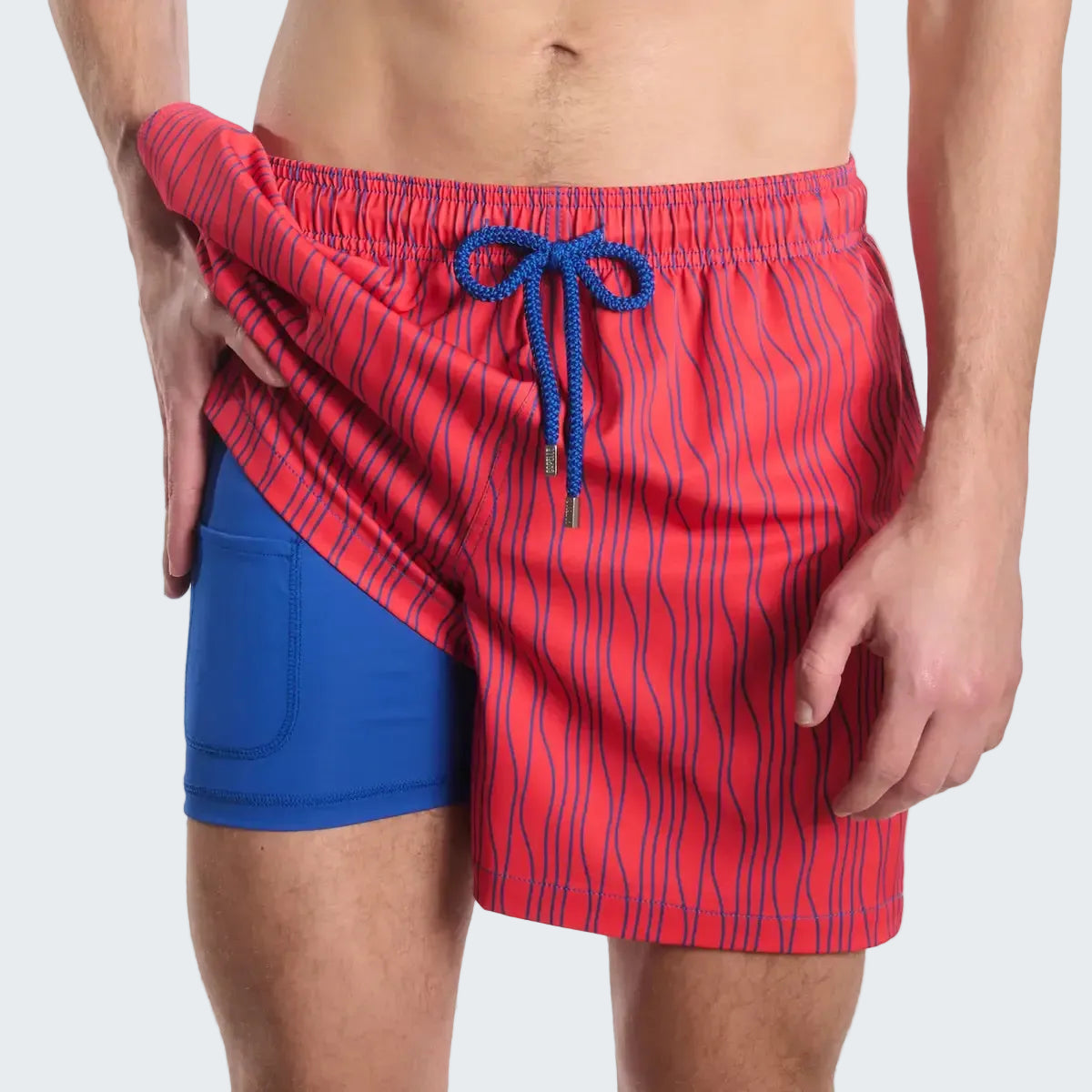 Red and blue striped swim shorts with a drawstring on a white background