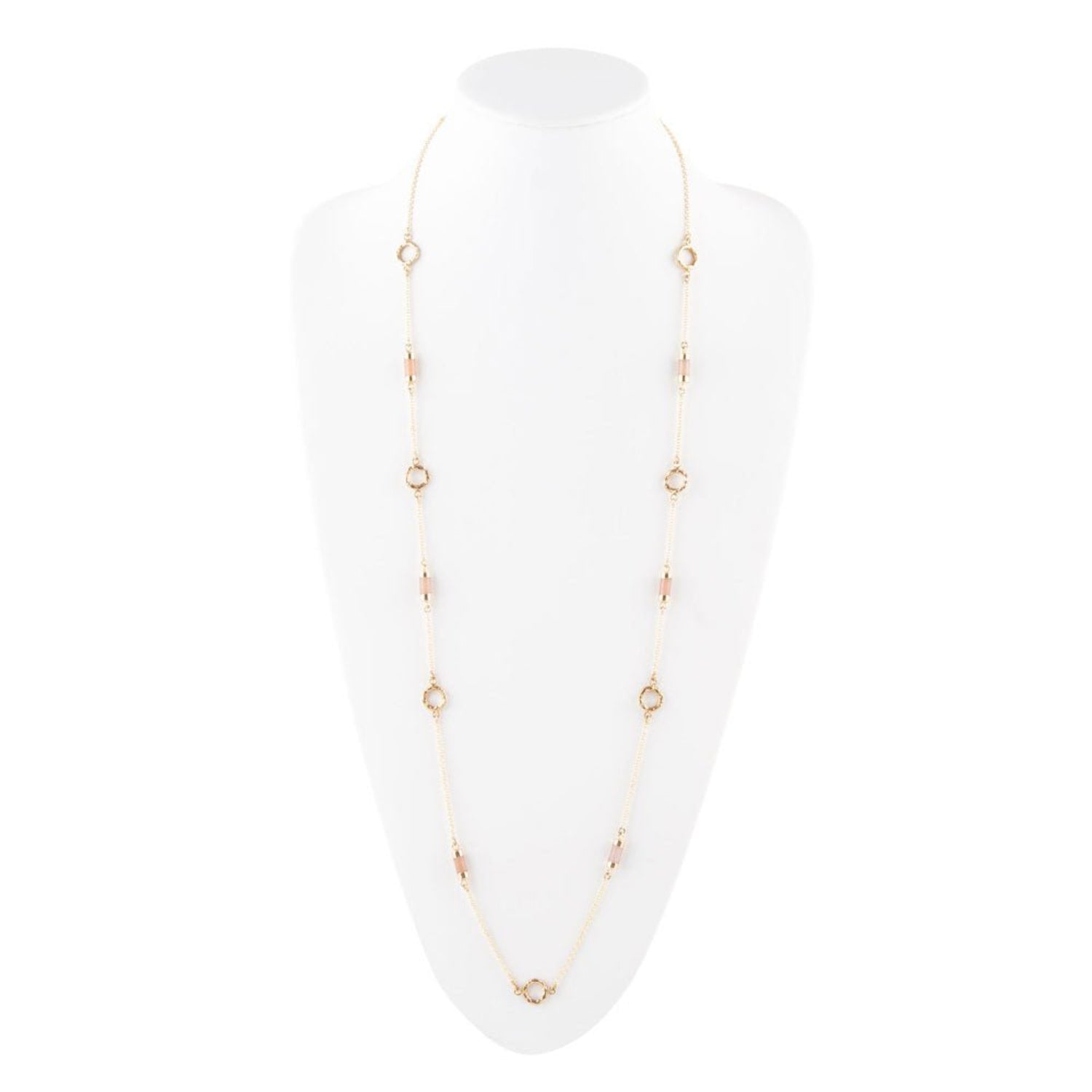 Gold necklace on a white mannequin bust with a white background