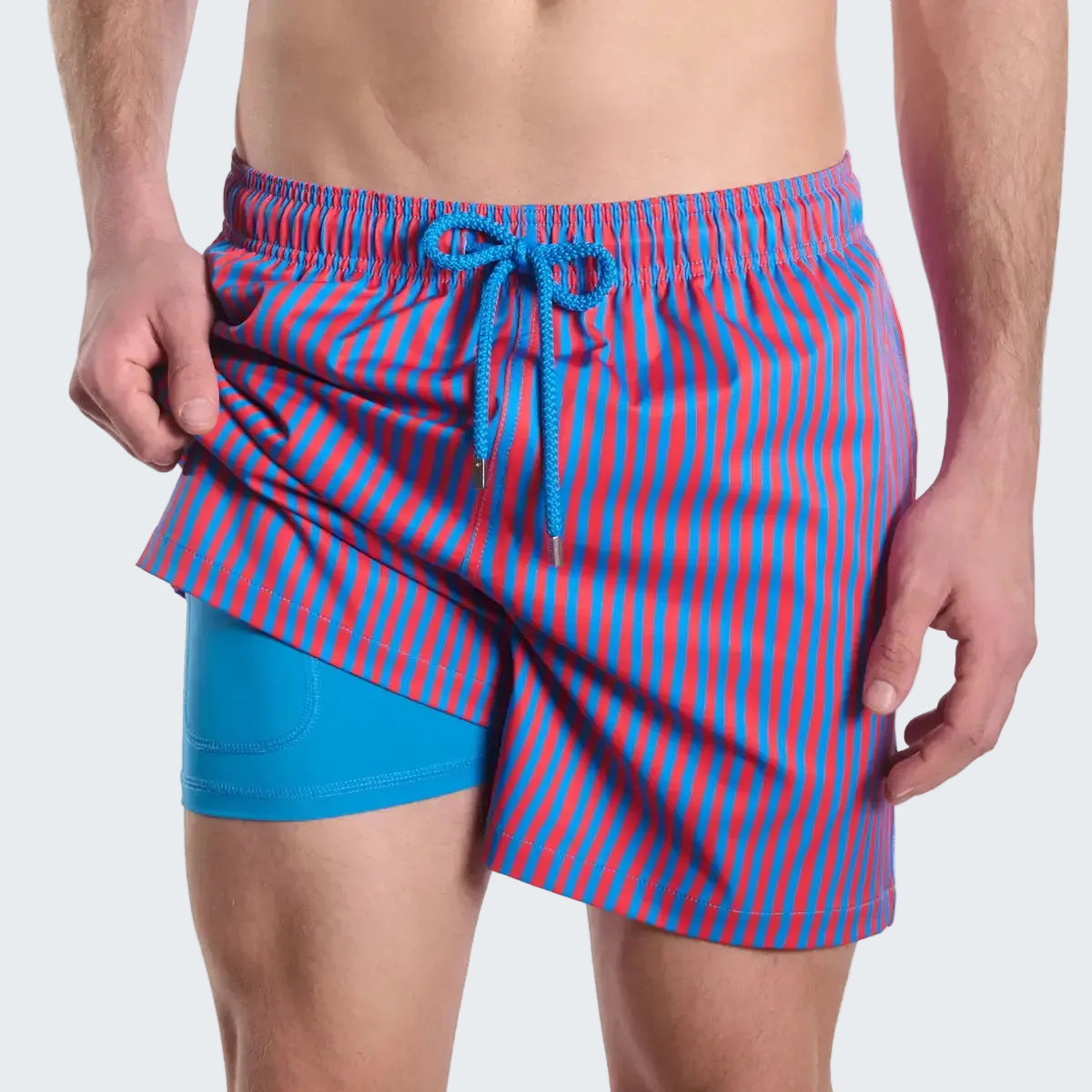 Blue and red striped swim shorts on a white background