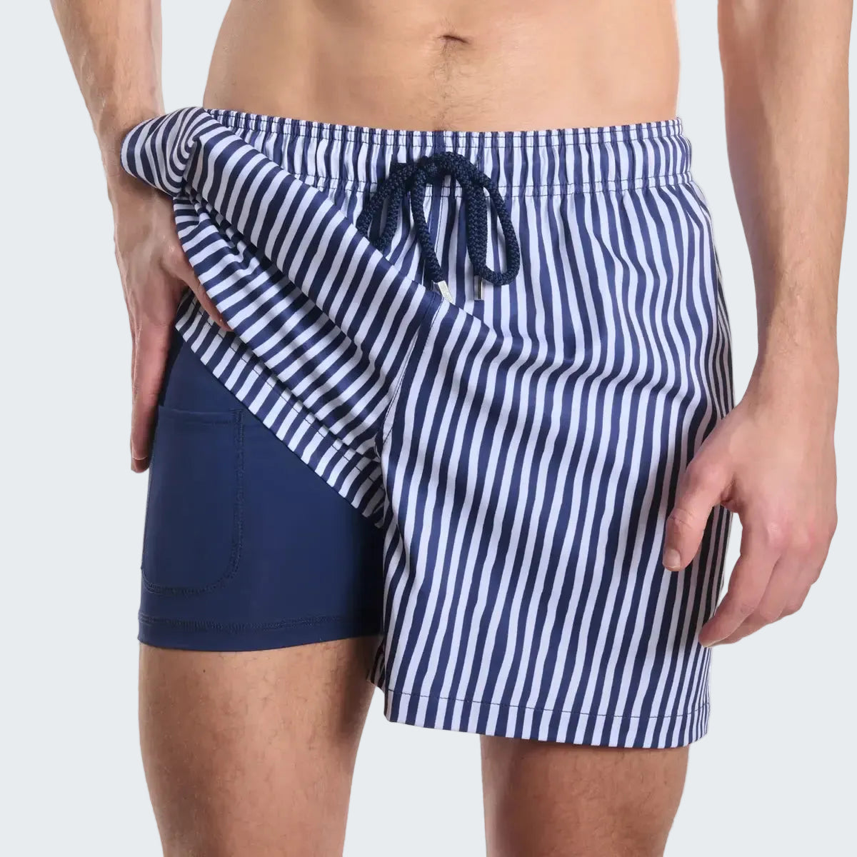 Navy and white striped swim shorts with a drawstring on a white background